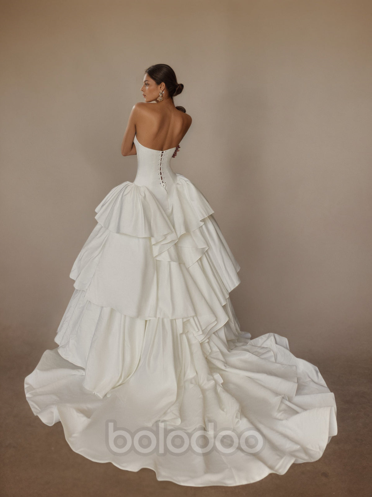 BOLODOO Ivory Strapless Straight Neckline Boned Corset Satin Tiered Ruffle Ball Gown - back view open back pearl buttons with train | BOLODOO watermark