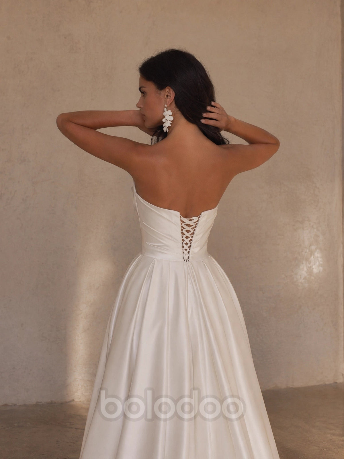 BOLODOO Ivory Strapless Sweetheart Ruched Satin A-Line Wedding Gown - back view lace-up corset open back | BOLODOO watermark