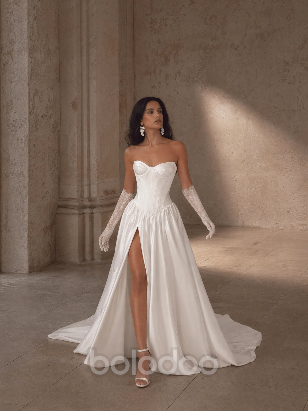 BOLODOO Ivory Strapless Sweetheart Boned Corset Satin A-Line Wedding Gown - front view 2 with train and lace gloves | BOLODOO watermark