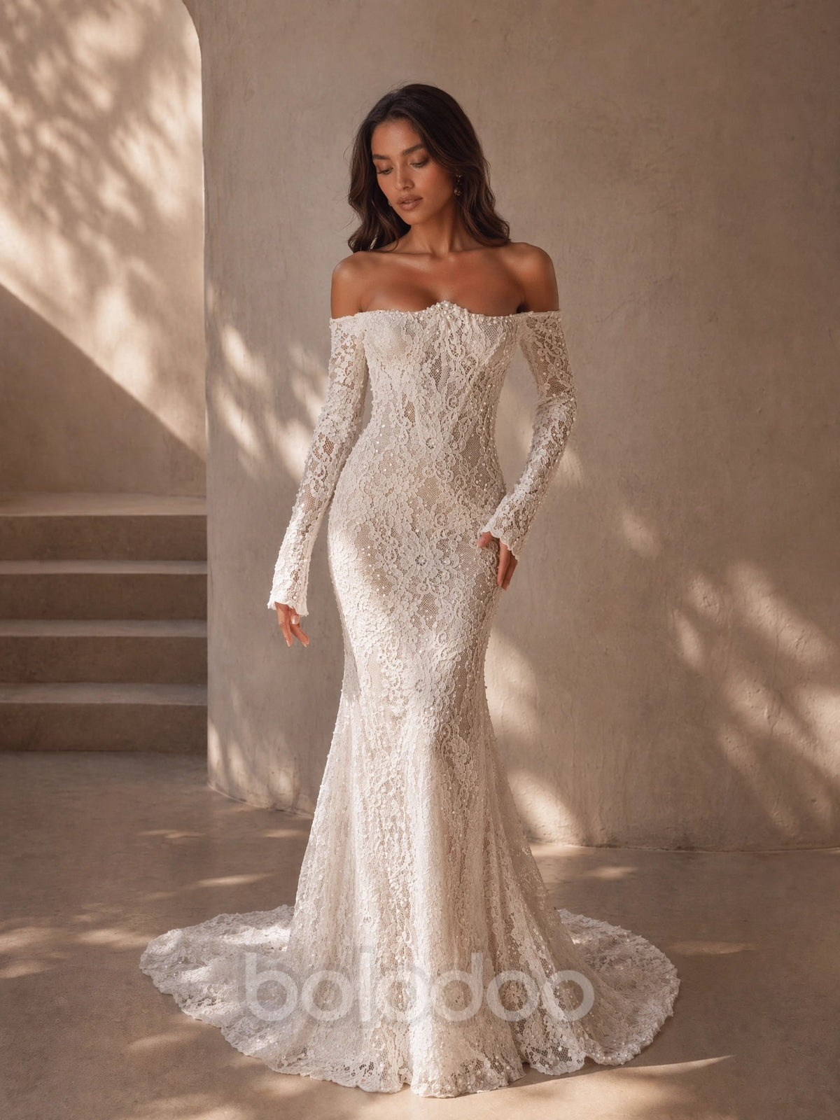 BOLODOO Ivory Off-Shoulder Long Sleeve All-Over Lace Embroidered Mermaid Wedding Gown - front view 2 with train | BOLODOO watermark