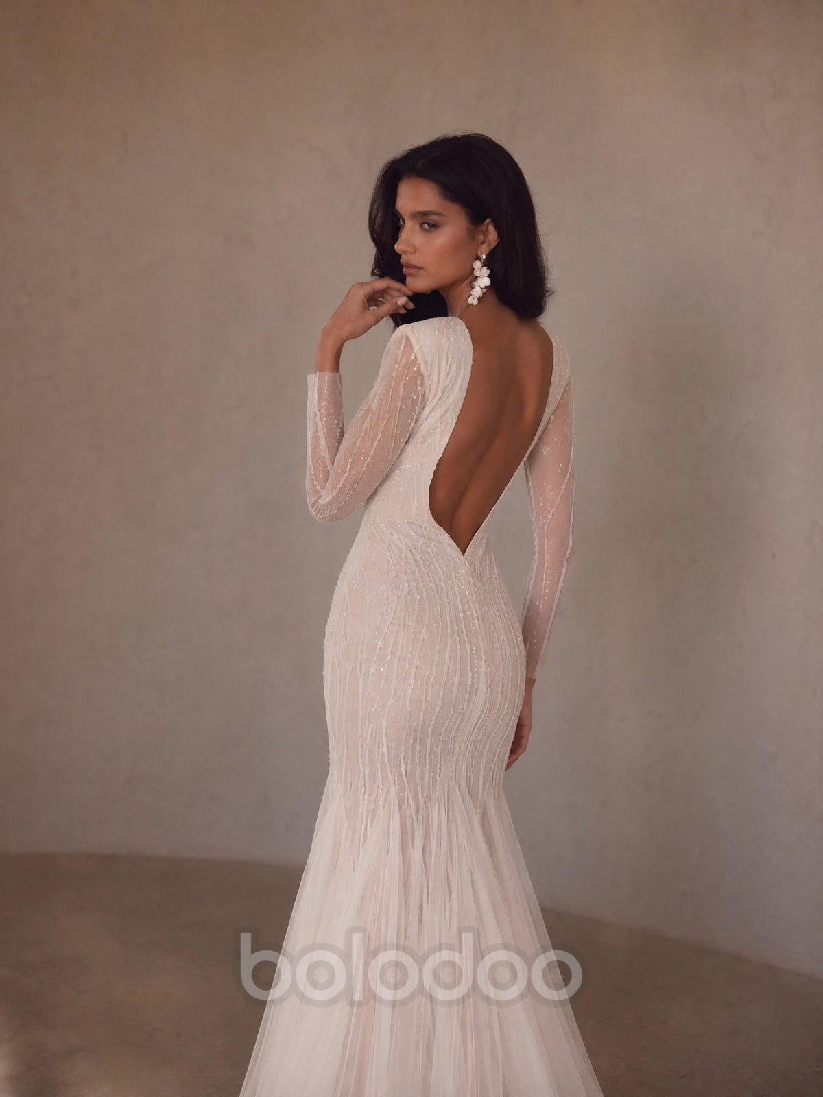 BOLODOO Ivory Deep V-Neck Long Sleeve Radiating Crystal Beaded Sheer Mermaid Wedding Gown - back view fully open U-back with tulle train | BOLODOO watermark