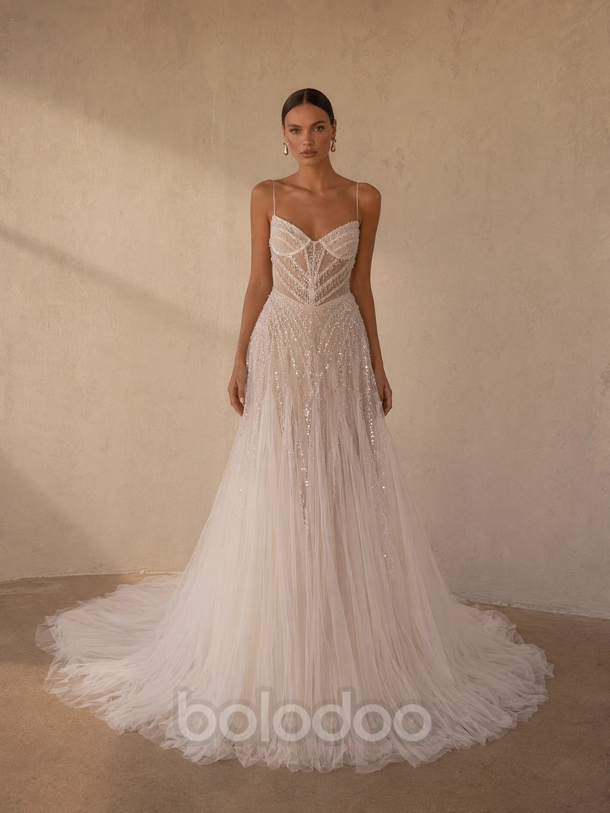 BOLODOO Ivory Spaghetti Strap Sweetheart All-Over Sequin Crystal Beaded Sheer Boned Corset A-Line Tulle Wedding Gown - full front view with high slit | BOLODOO watermark