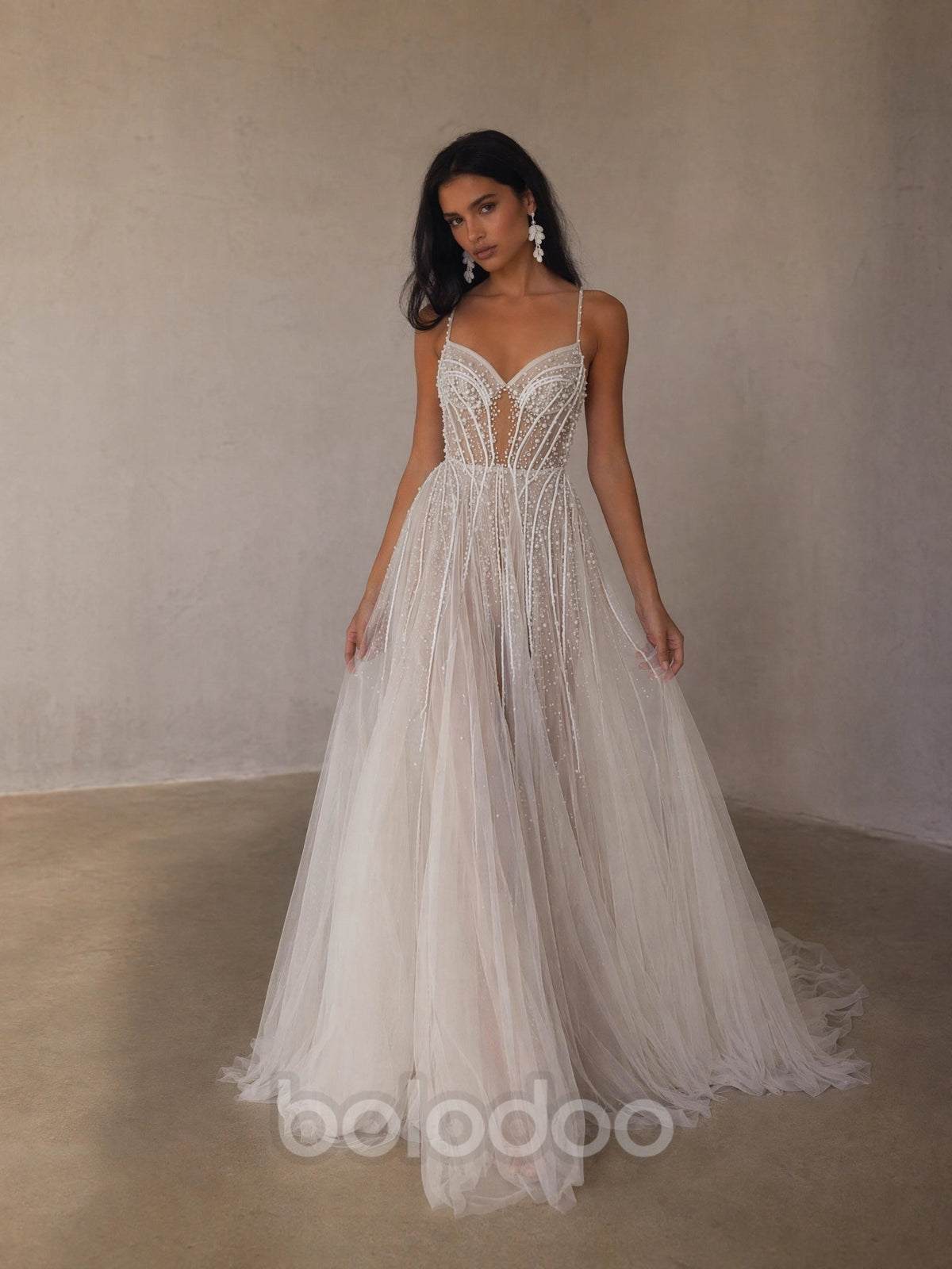 BOLODOO Ivory Spaghetti Strap Sweetheart All-Over Pearl Crystal Beaded Sheer Boned Corset A-Line Tulle Wedding Gown - front view 2 with feather-edge train | BOLODOO watermark