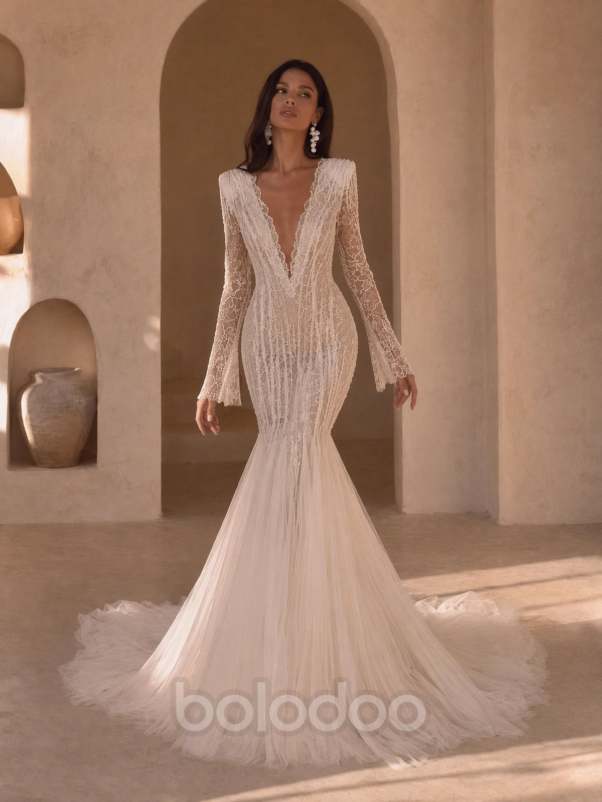 BOLODOO Ivory Deep V-Neck All-Over Mesh Lace Embroidered Long Bell Sleeve Mermaid Wedding Gown - front view 2 with bell cuff sleeves and sweeping train | BOLODOO watermark