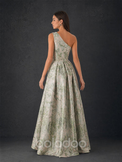 BOLODOO sage green metallic jacquard one-shoulder gown - front close-up showing side slit detail and box pleat skirt | BOLODOO watermark