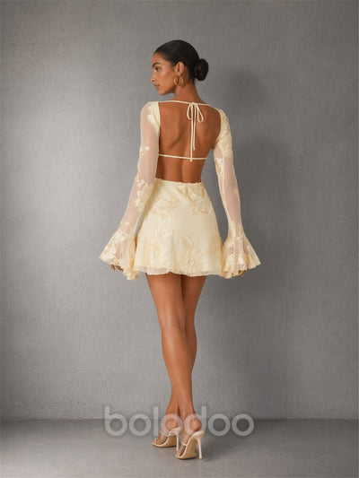 BOLODOO cream 3D floral lace mini dress - front walking view showing bell sleeve movement and floral embroidery texture | BOLODOO watermark