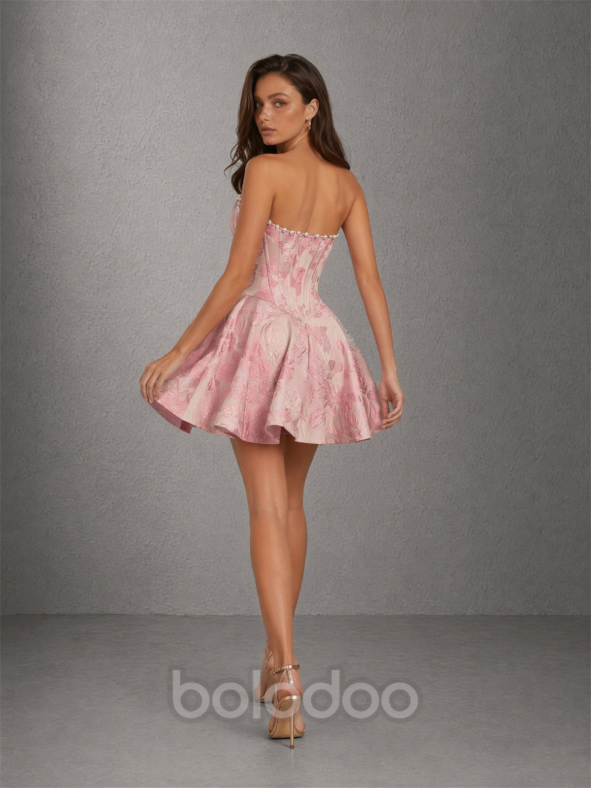 BOLODOO pink jacquard pearl trim strapless sweetheart boned corset fit-and-flare mini dress - front view hands in hair | BOLODOO watermark