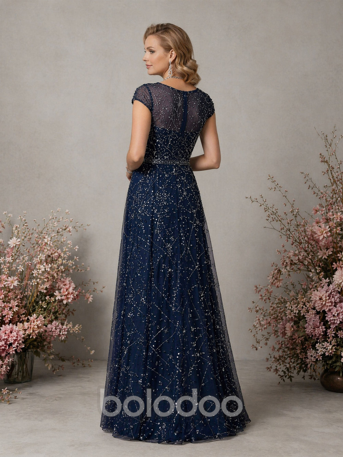 BOLODOO Navy Blue Constellation Sequin Beaded Illusion Bateau Neck Cap Sleeve A-Line Maxi Dress - Back View showing Covered Back Cap Sleeves and Full A-Line Skirt | BOLODOO watermark