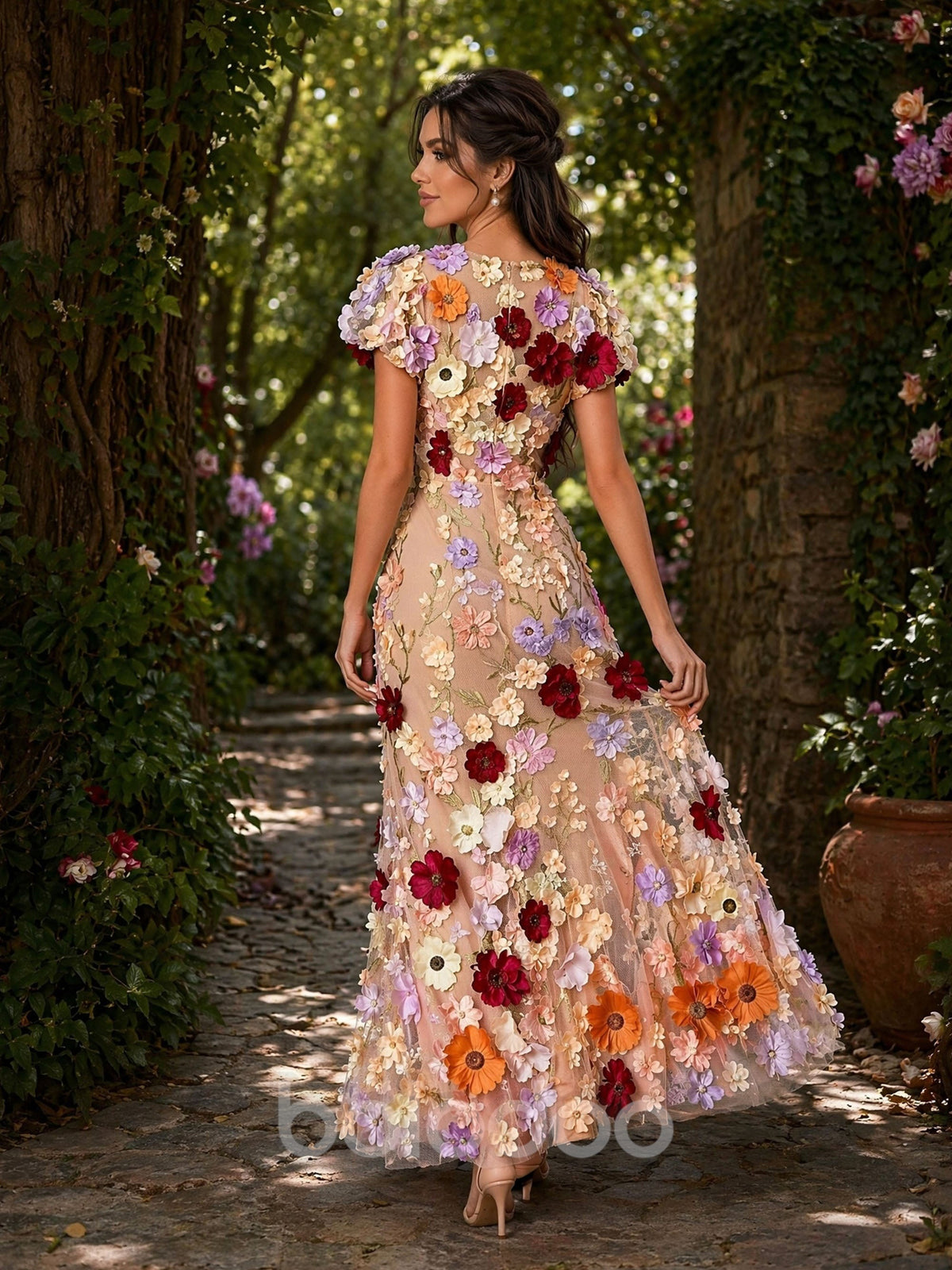 BOLODOO BD0372 champagne 3D multicolor floral maxi dress - back view in garden setting showing covered back, puff sleeves and flowing flared hem | BOLODOO watermark