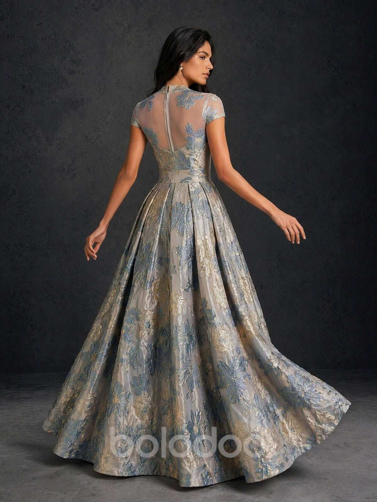 BOLODOO silver blue gold floral jacquard sheer cap sleeve A-line ball gown – back full length view showing sheer illusion back zipper and box pleated skirt | BOLODOO watermark