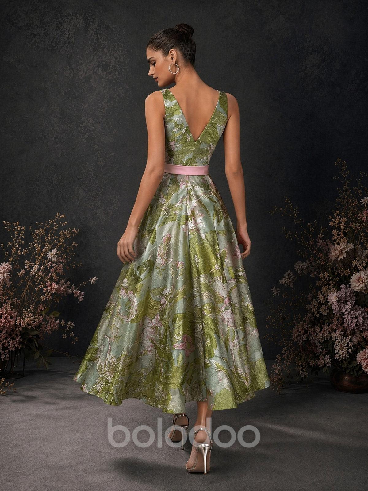 BOLODOO olive green floral jacquard sleeveless A-line tea length dress with deep V open back and pink satin bow belt – back full length view | BOLODOO watermark