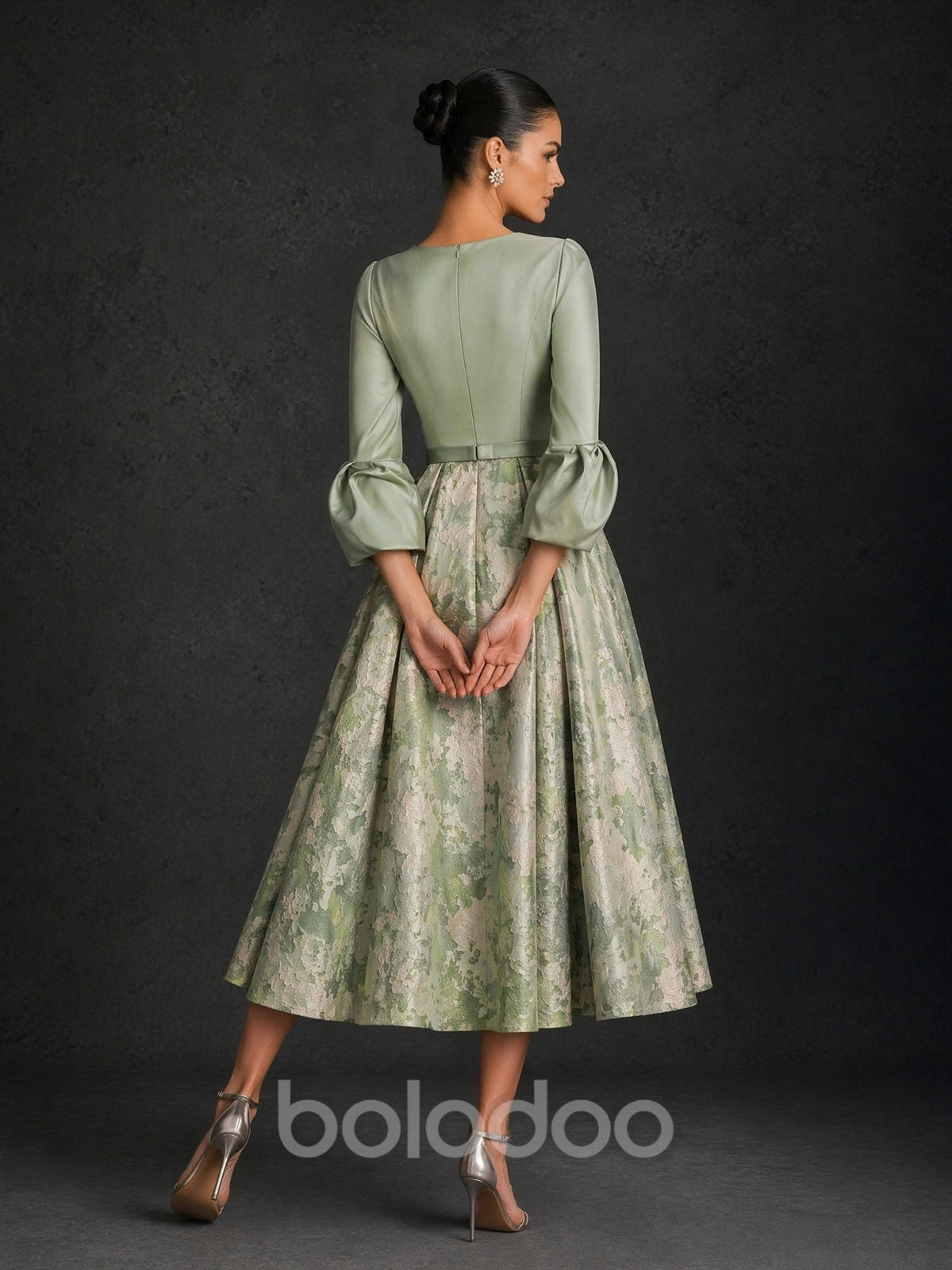 BOLODOO sage green satin V-notch 3/4 puff sleeve floral jacquard tea length dress close-up front view showing neckline bishop sleeve and slim buckle belt detail | BOLODOO watermark
