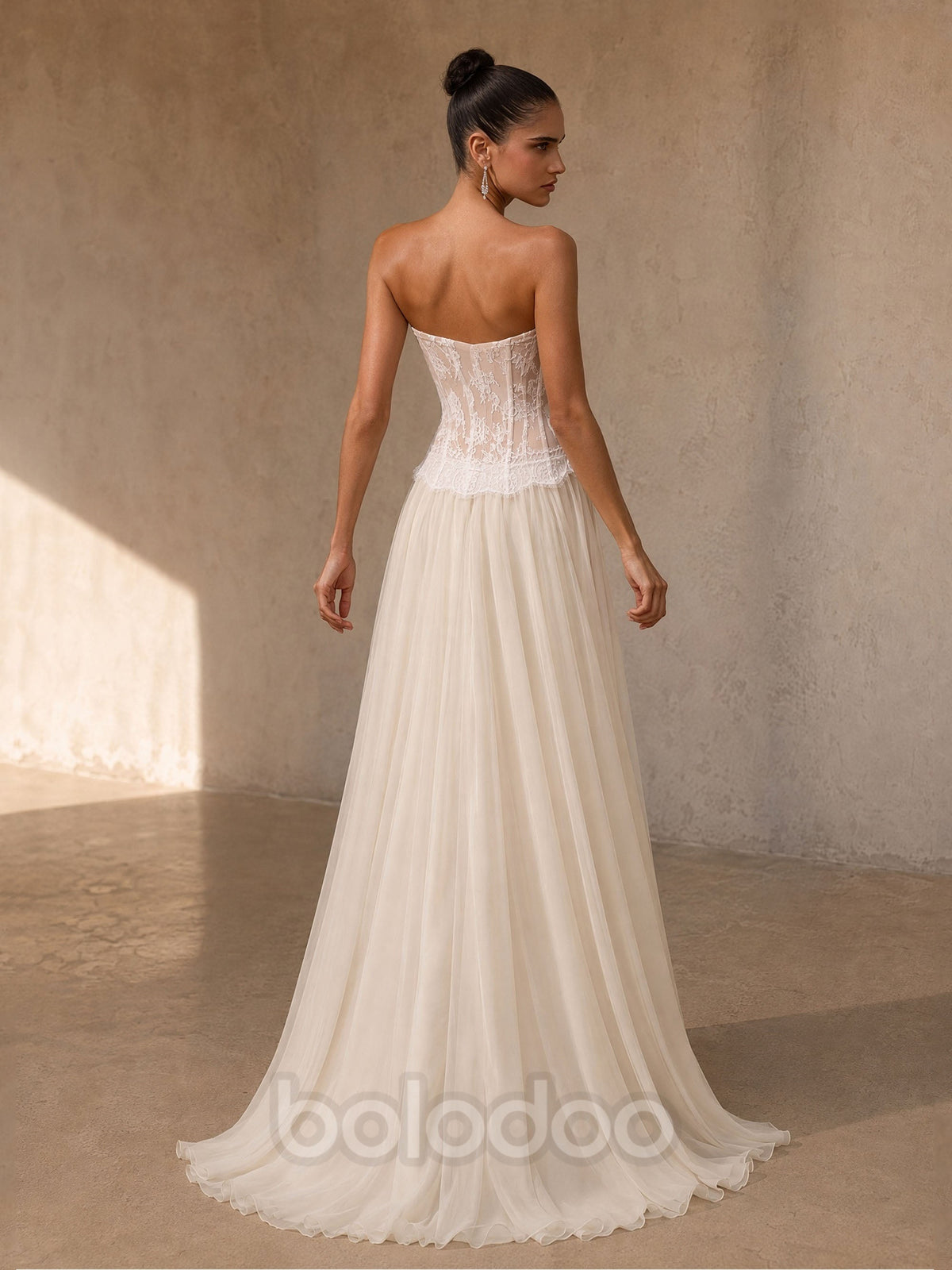 BOLODOO BD0508 ivory sheer lace corset strapless wedding gown – upper body close-up showing sheer floral lace corset bodice and scalloped waist detail | BOLODOO watermark