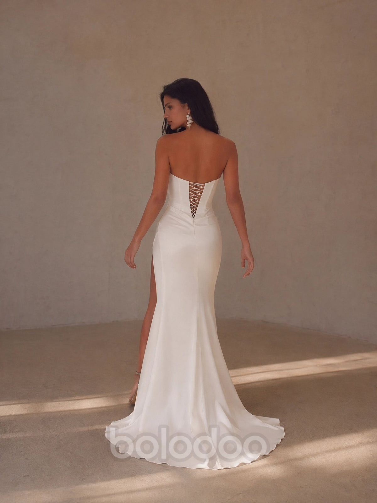BOLODOO White Strapless Straight Neck Ruched Satin Mermaid Wedding Gown - back view lace-up corset open back with train | BOLODOO watermark