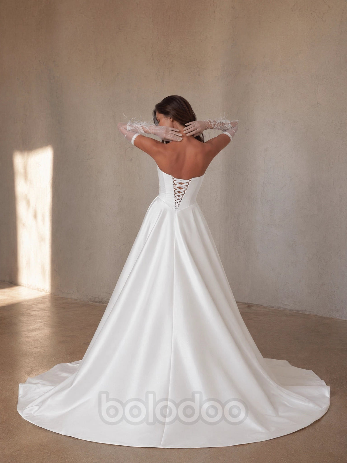 BOLODOO White Strapless Sweetheart Satin A-Line Princess Ball Gown - back view lace-up corset open back with cathedral train | BOLODOO watermark