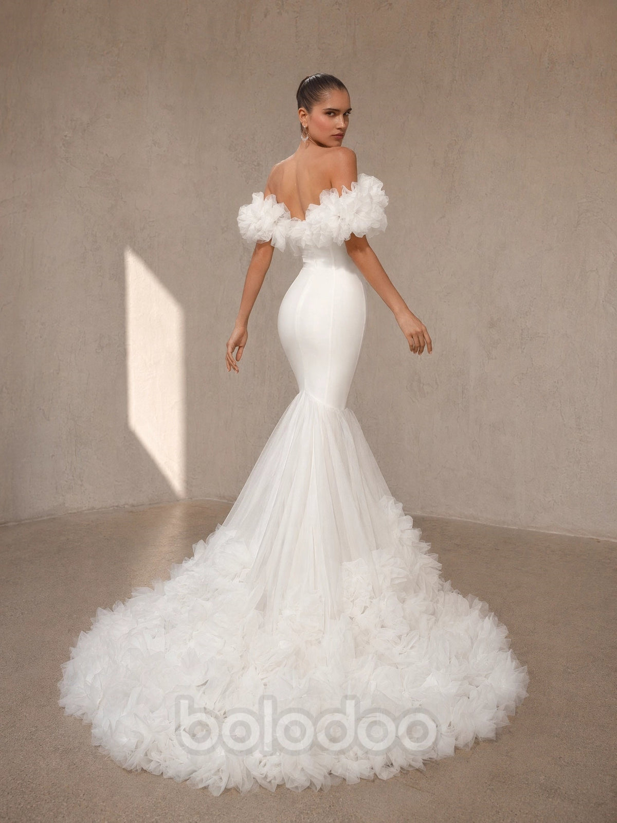 BOLODOO White Off-Shoulder 3D Floral Tulle Puff Sleeve Mermaid Wedding Gown - back view open back with sweeping feather floral train | BOLODOO watermark
