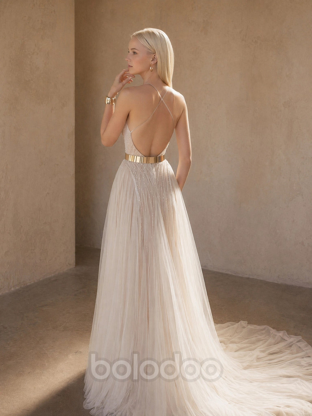 BOLODOO Champagne Halter Neck Crossover Keyhole Crystal Beaded Sheer Tulle A-Line Wedding Gown - back view fully open back with spaghetti strap cross-back and train | BOLODOO watermark