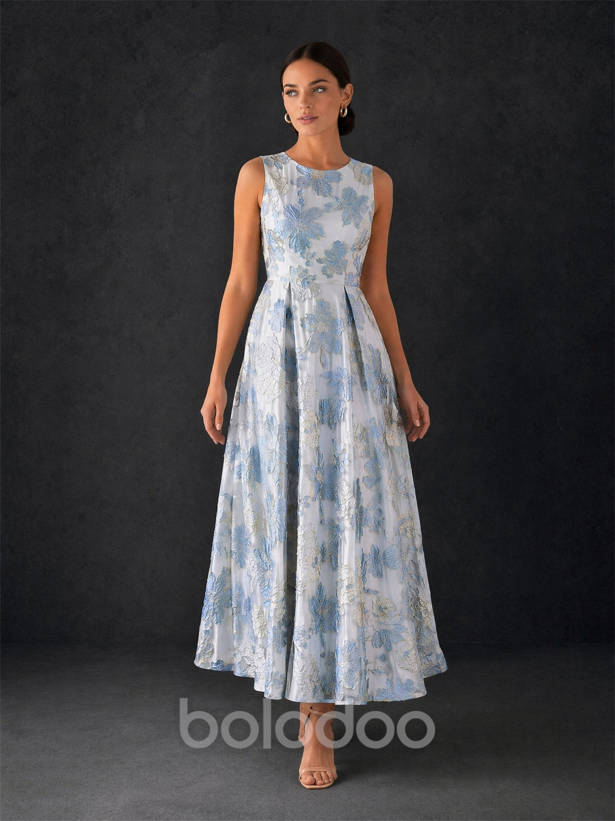 BOLODOO ice blue jacquard midi dress - front view with hand on hip showing structured bodice and full pleated skirt volume | BOLODOO watermark