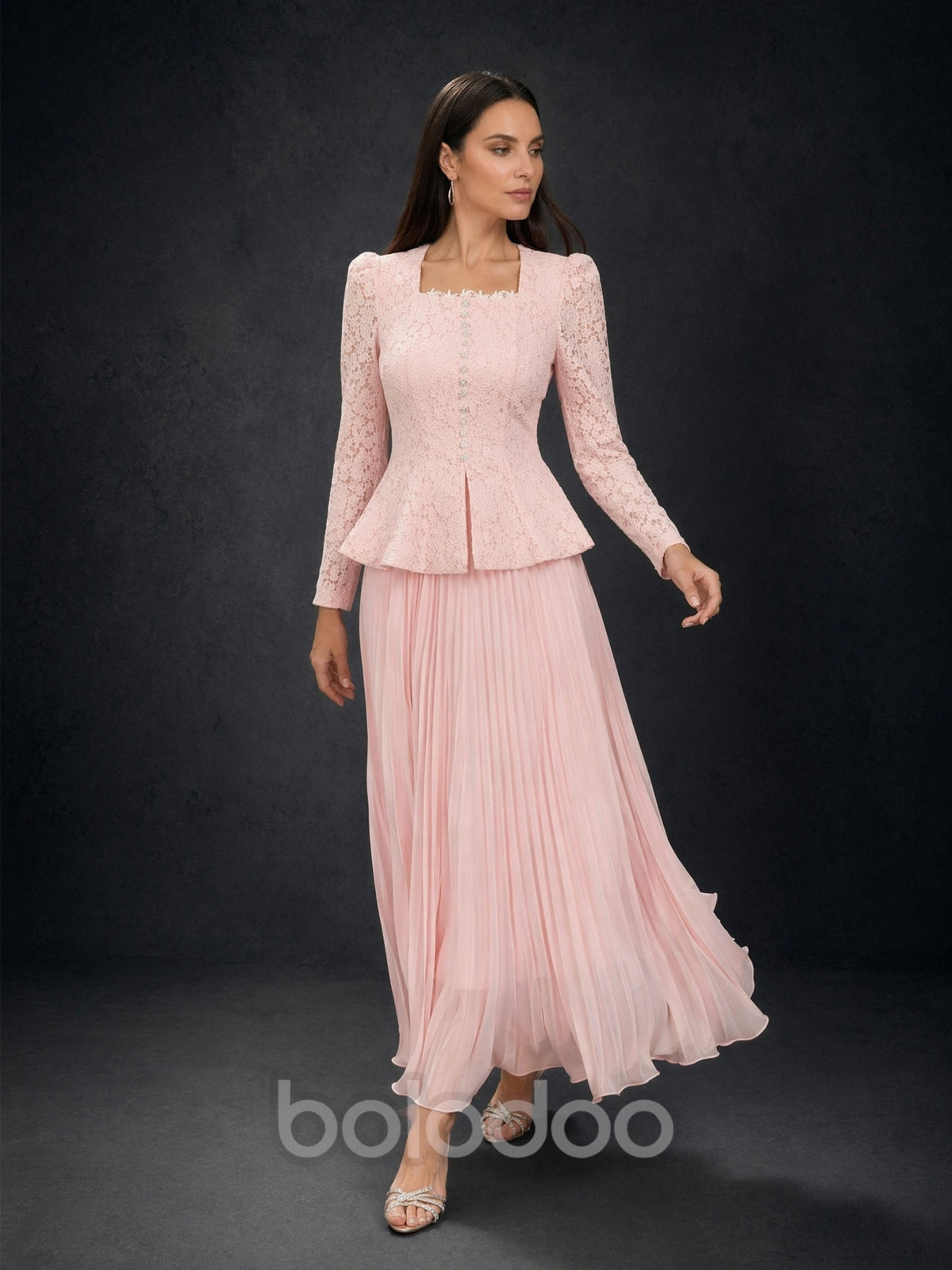BOLODOO Blush Pink Lace Long Sleeve Peplum Pleated Maxi Dress - Front View with Flowing Skirt | BOLODOO watermark
