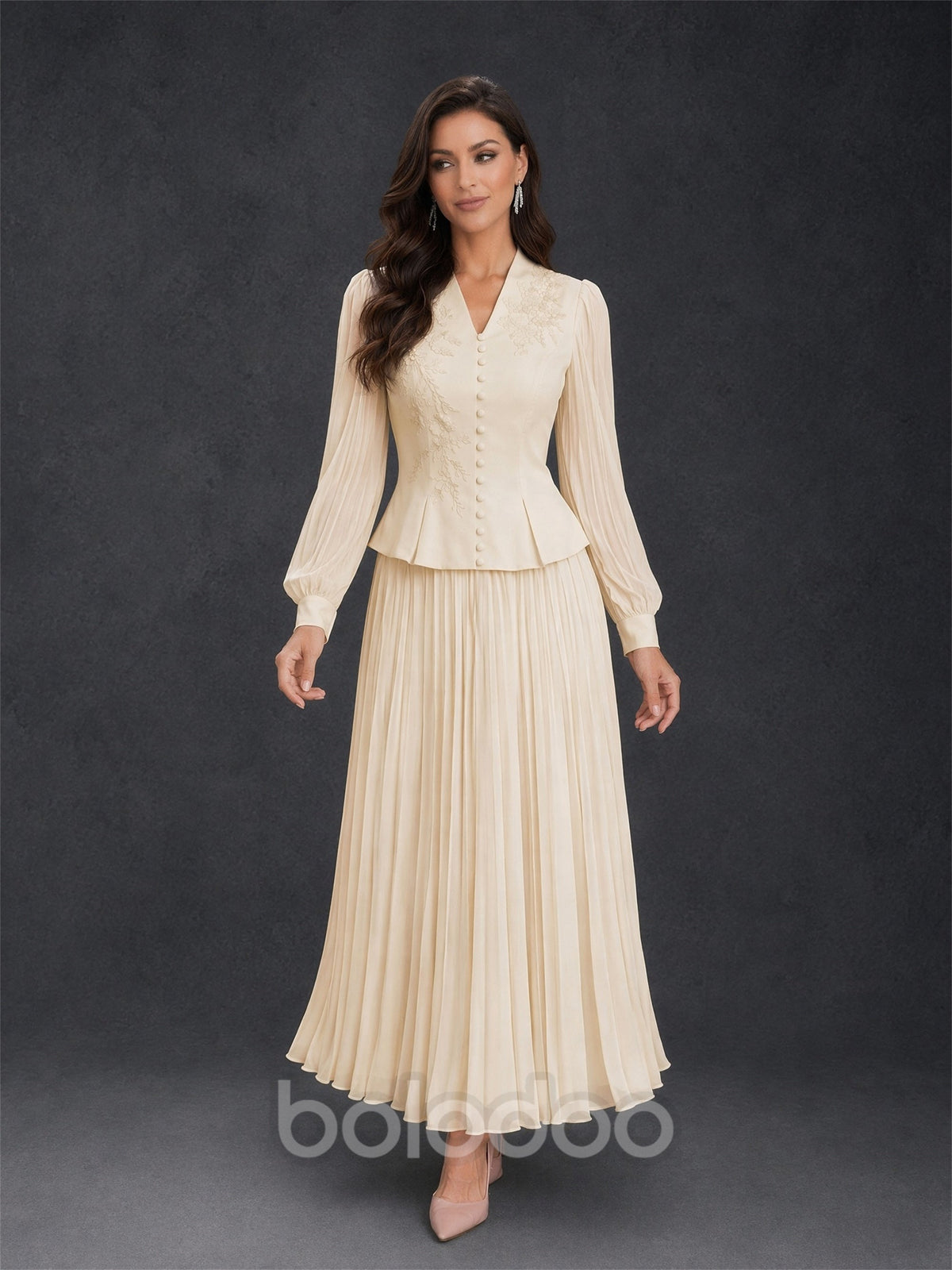 BOLODOO Champagne Ivory Lace Embroidered V-Neck Lantern Sleeve Peplum Pleated Maxi Dress - Front View with Flowing Skirt | BOLODOO watermark