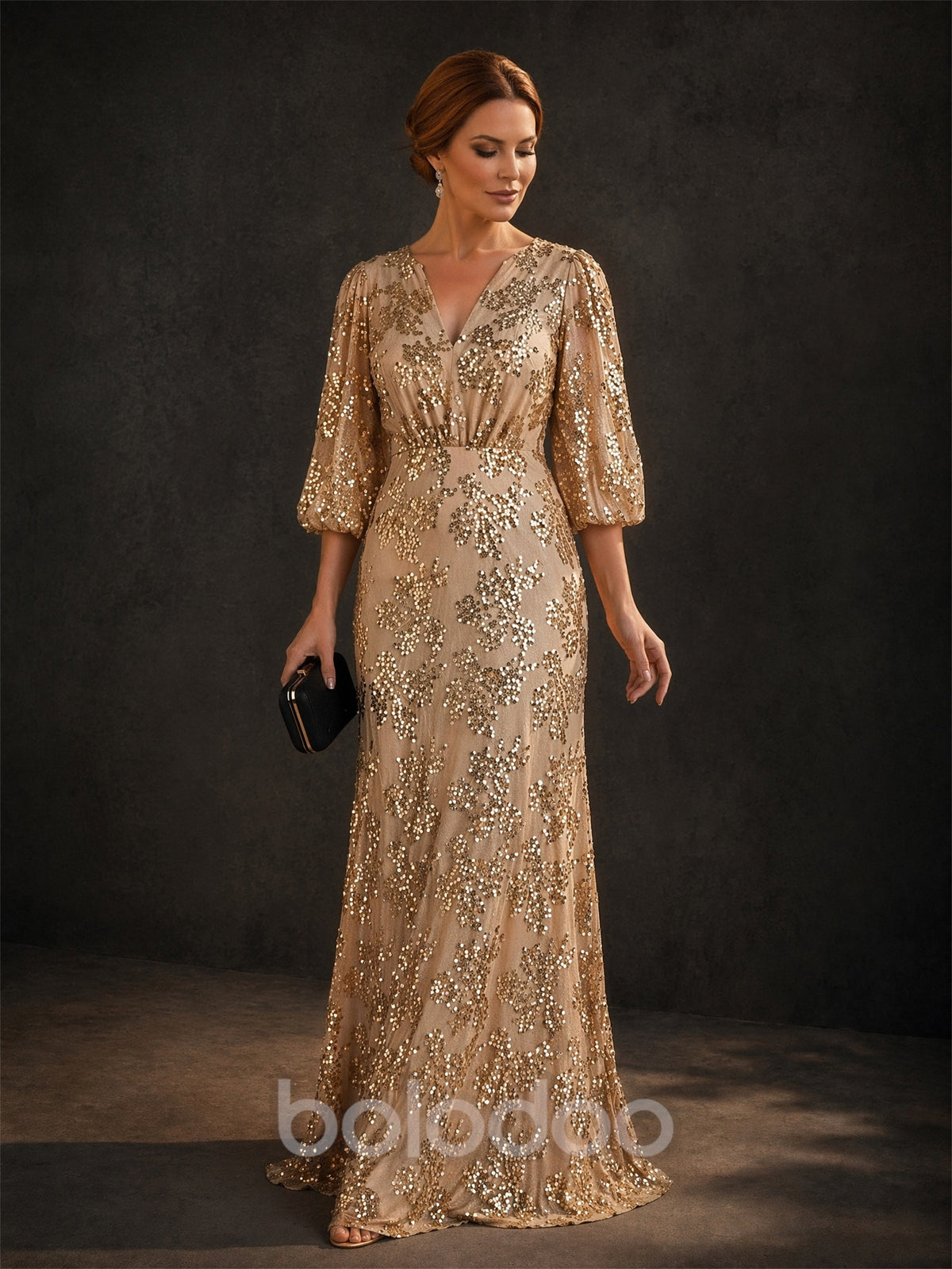 BOLODOO Champagne Gold V-Neck Lantern Sleeve All-Over Sequin Mermaid Gown – Front View Full Length with Clutch | BOLODOO watermark