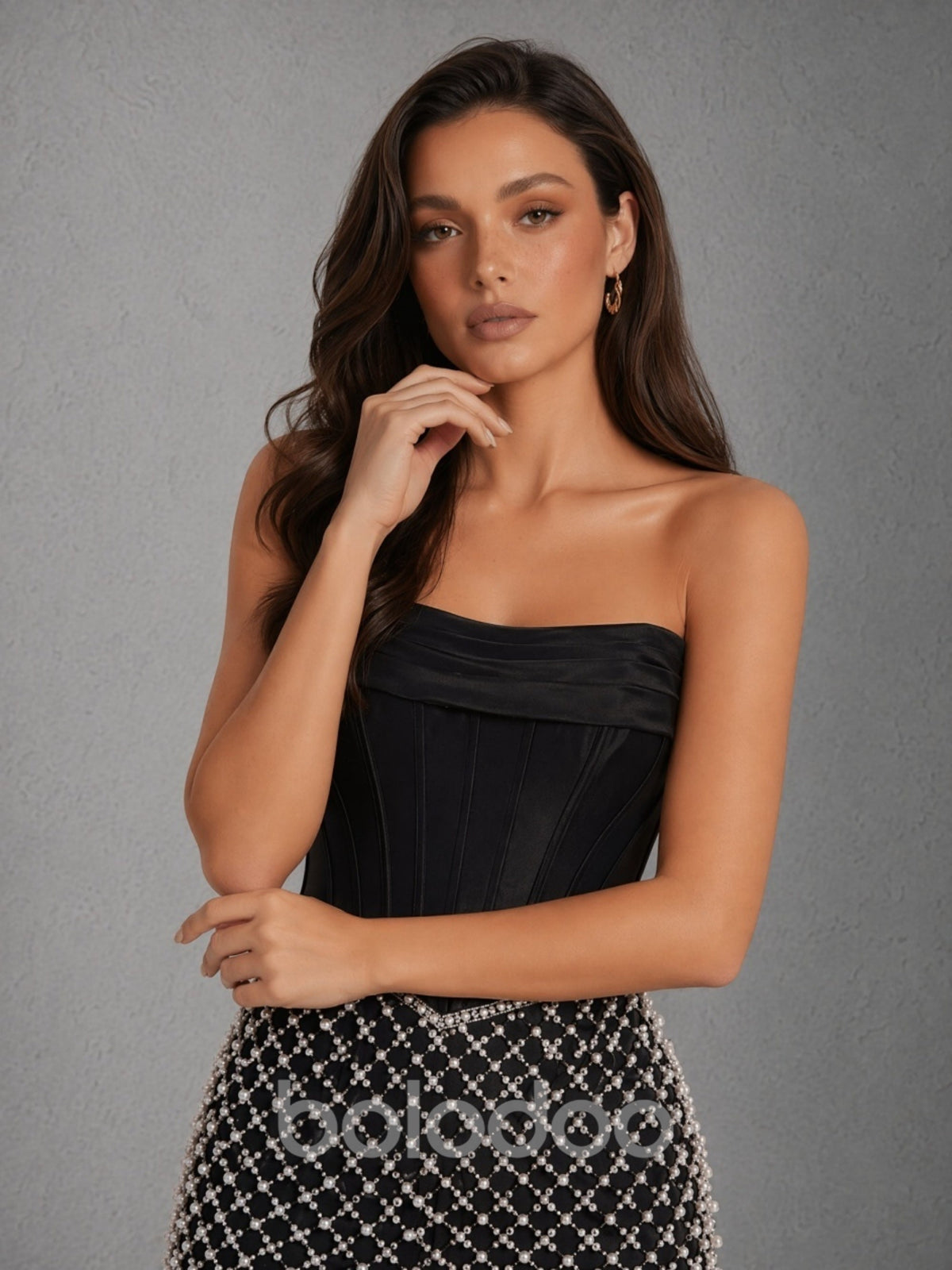 BOLODOO black strapless boned satin corset mini dress with silver geometric pearl beaded skirt - full front view looking down dynamic pose | BOLODOO watermark