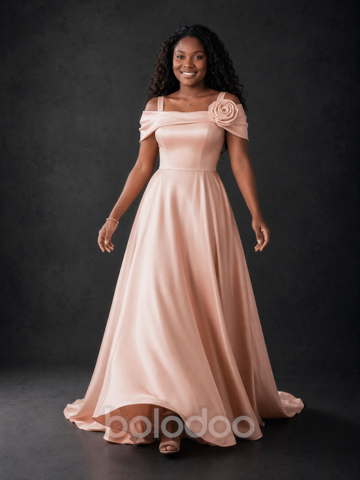 BOLODOO blush pink off-shoulder satin maxi dress with 3D rose - front full length smiling pose | BOLODOO watermark