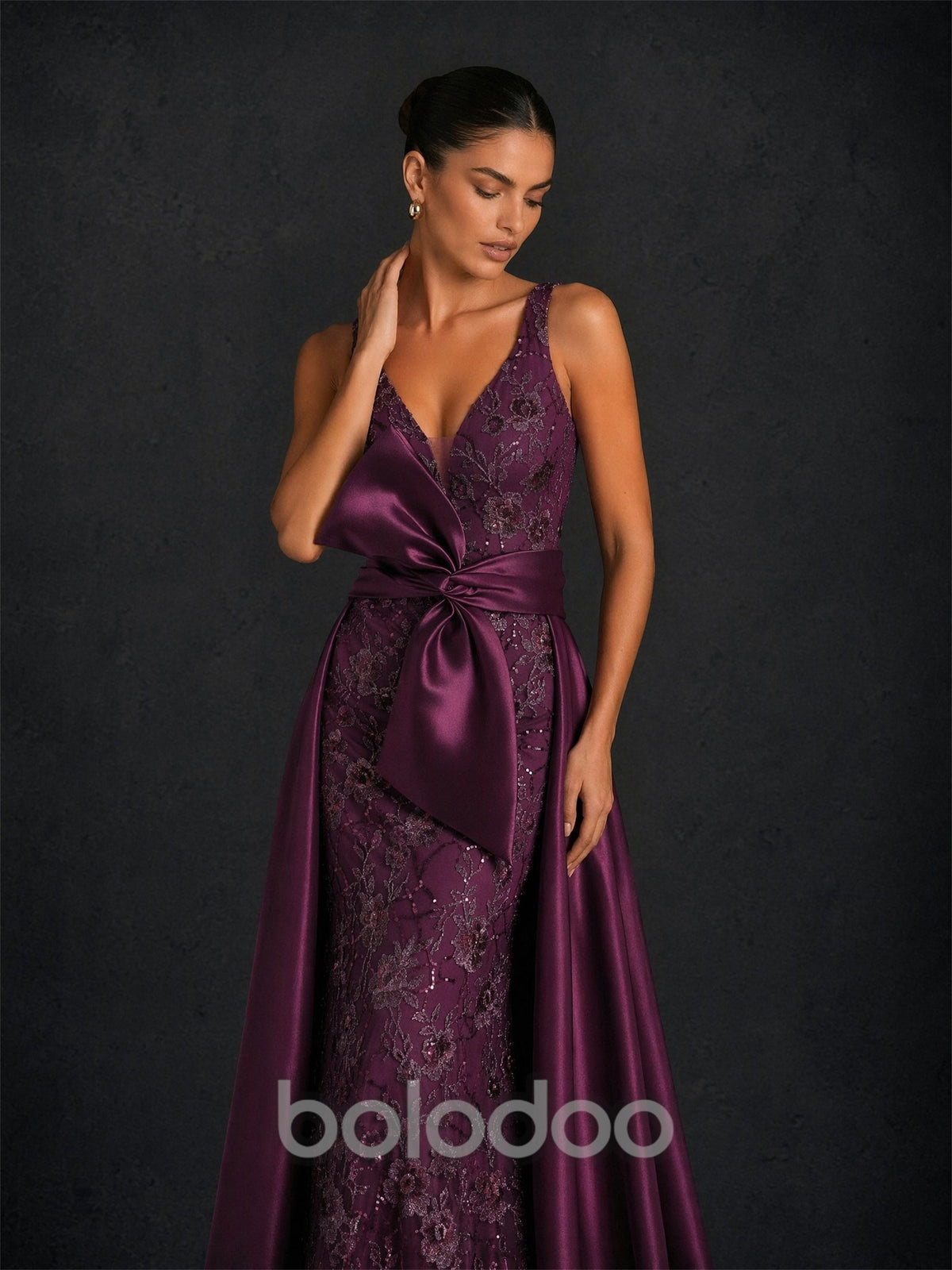 BOLODOO BD0374 deep purple sequin lace mermaid gown - front close-up showing deep V-neckline, oversized satin bow and sequin floral lace bodice | BOLODOO watermark