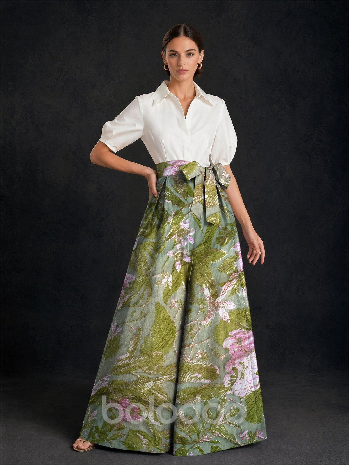 BOLODOO white puff sleeve shirt and green floral jacquard wide-leg pants set front view hand on hip showing full silhouette and bow waist | BOLODOO watermark