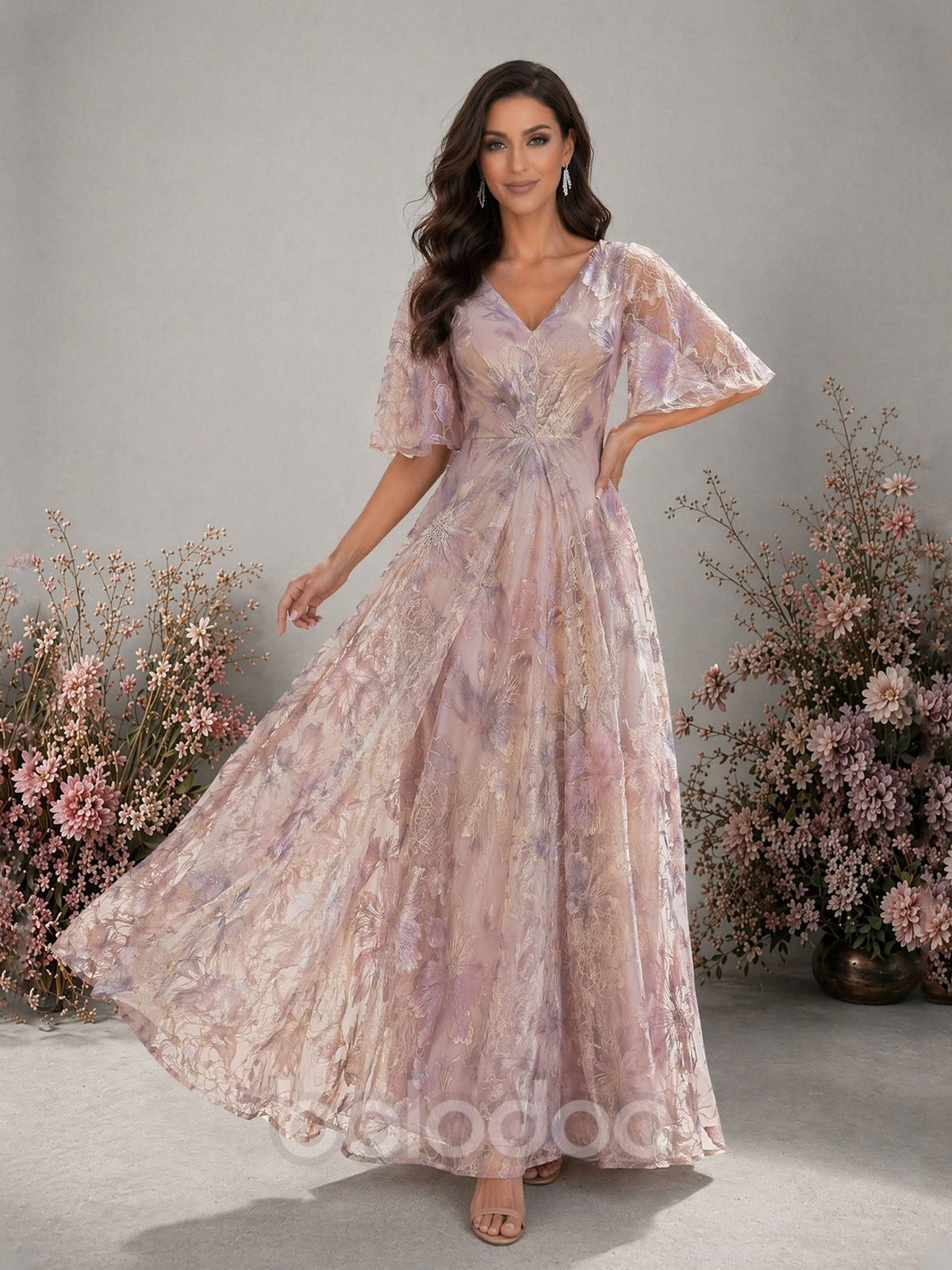 BOLODOO lavender metallic floral embroidered organza V-neck flutter sleeve empire waist A-line floor length gown – front full length dynamic walking view showing organza skirt movement | BOLODOO watermark