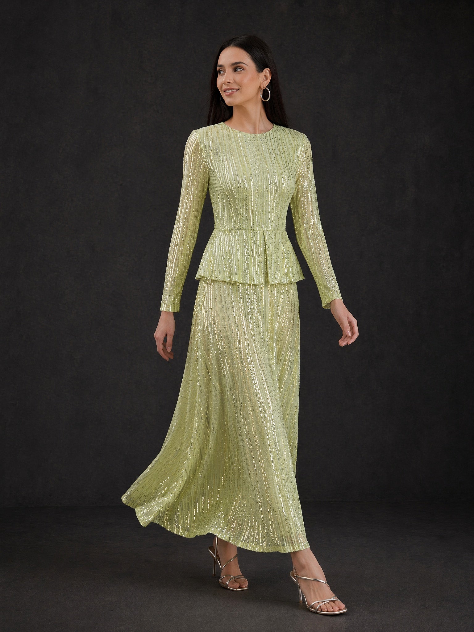 BOLODOO Sage Green Sequin Long Sleeve Peplum Maxi Dress - Front View with Flowing Skirt