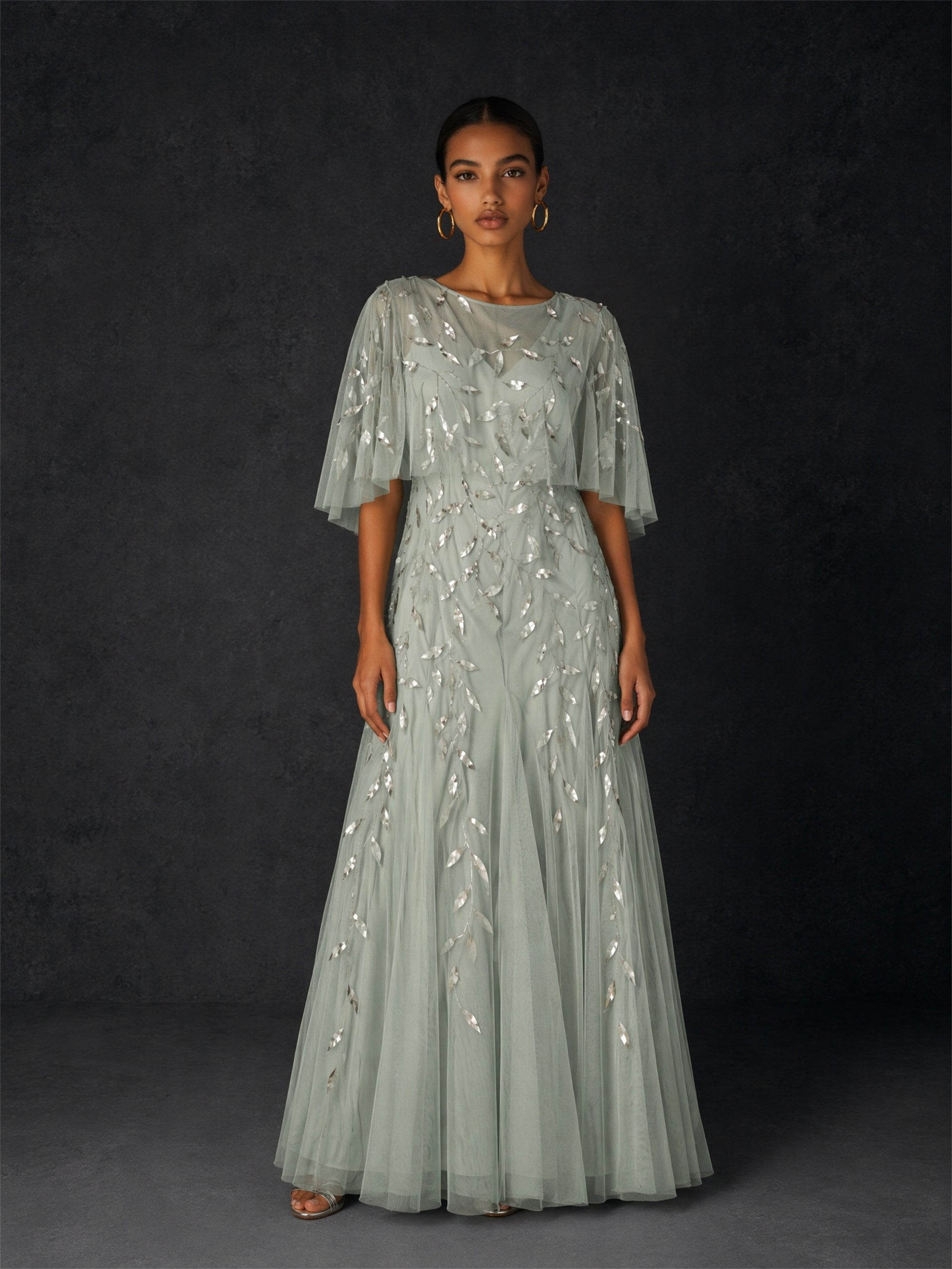 BOLODOO sage green sequin leaf embroidered flutter sleeve maxi dress - front full length hands clasped pose