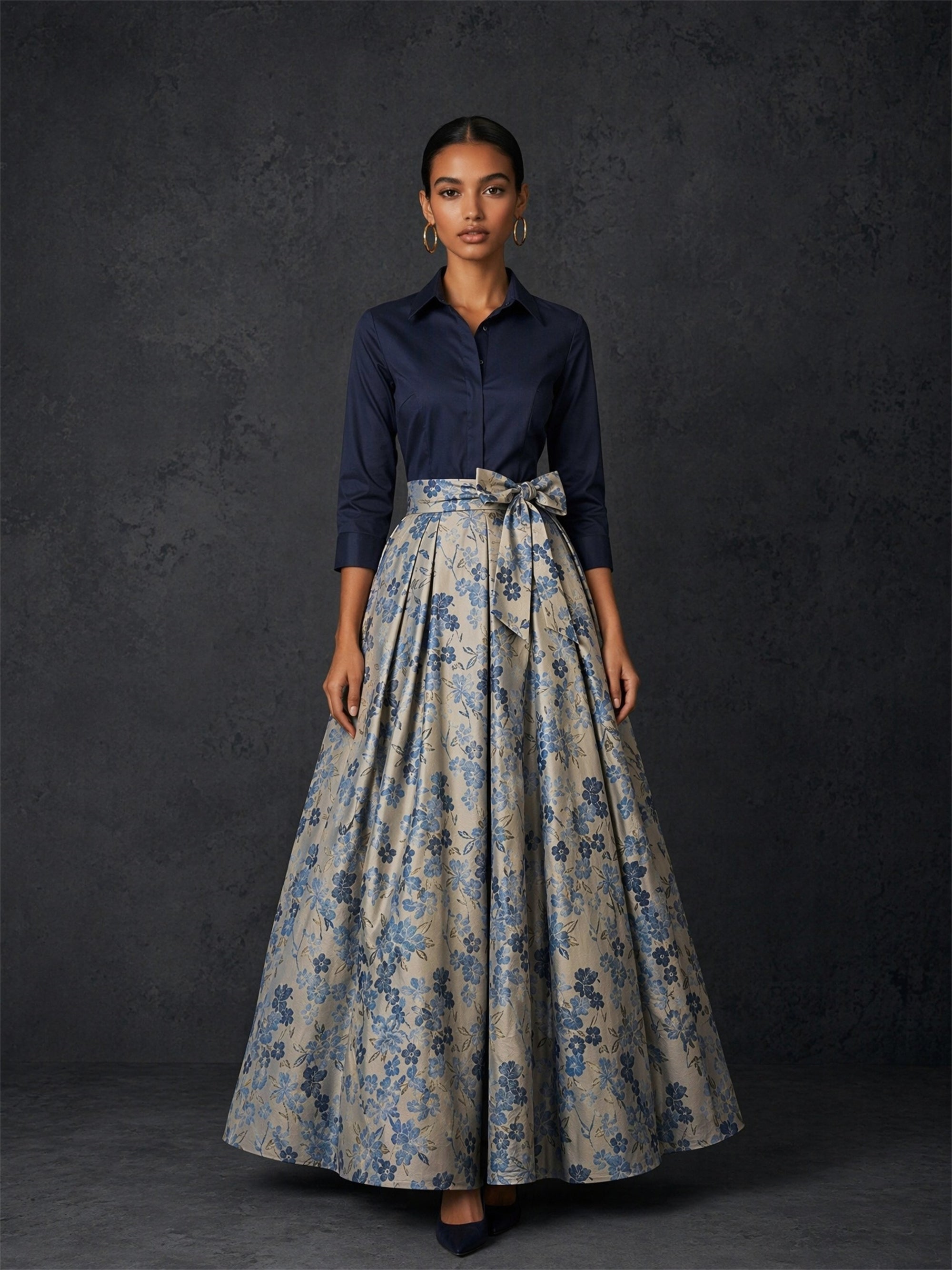 BOLODOO navy shirt and floral jacquard ball skirt set - front walking view showing dramatic A-line ball skirt movement and self-tie bow belt detail