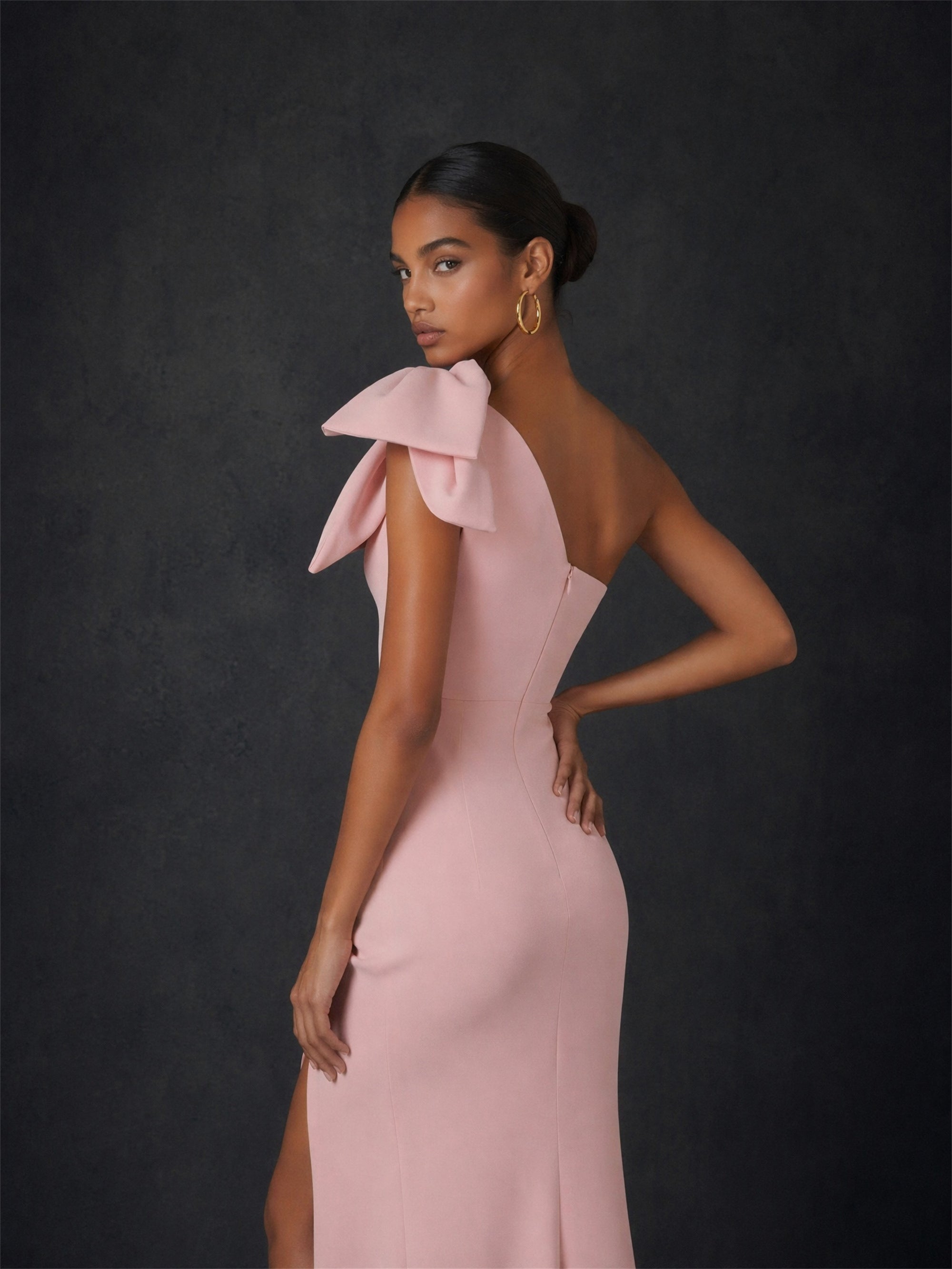 BOLODOO blush pink one-shoulder bow maxi dress - front full length view model looking down showing high slit and silhouette