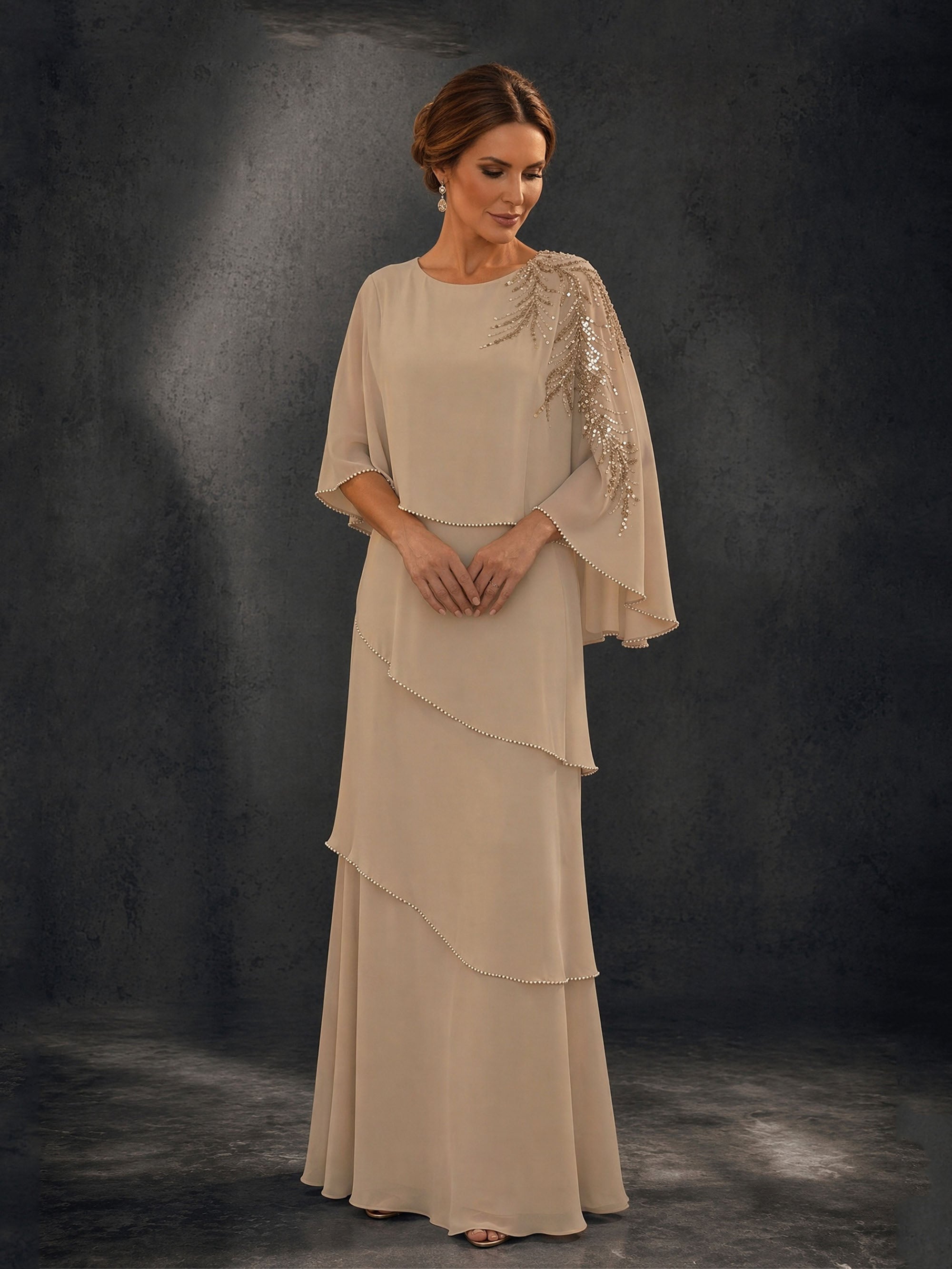 BOLODOO Champagne Mocha Asymmetric Cape Sleeve Gold Sequin Tiered Chiffon Gown – Front View Full Length Relaxed Pose