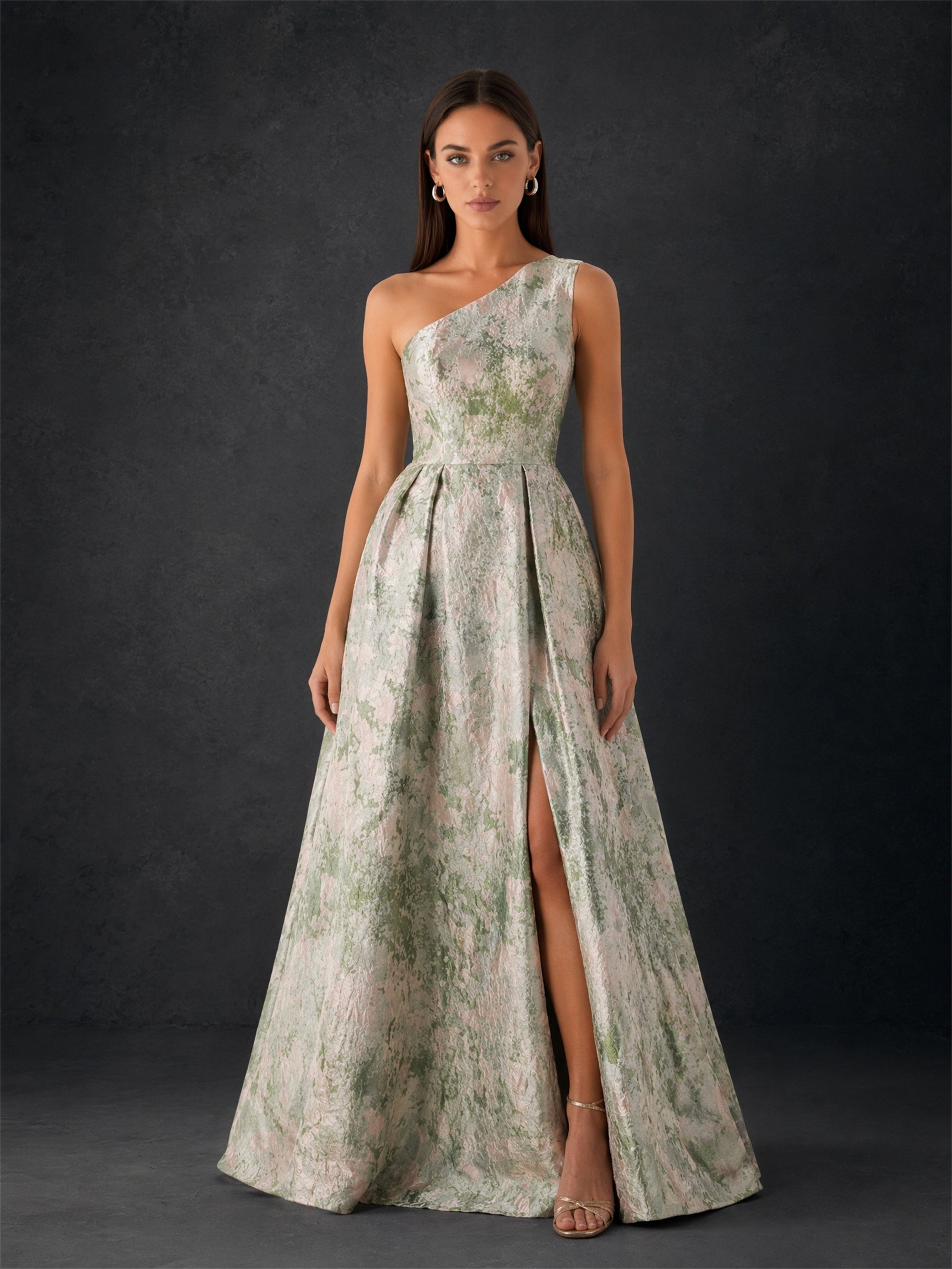 BOLODOO sage green metallic floral jacquard one-shoulder A-line side slit maxi gown - front full body view with gold heeled sandals