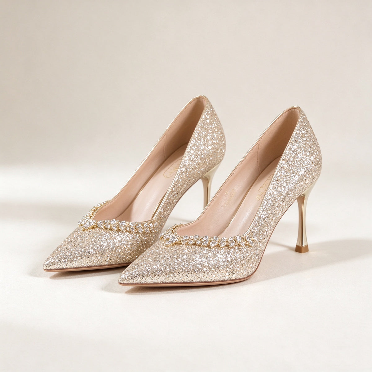 BOLODOO EE0010 champagne gold glitter pointed-toe bridal pumps with leaf-shaped jewel trim, pair view