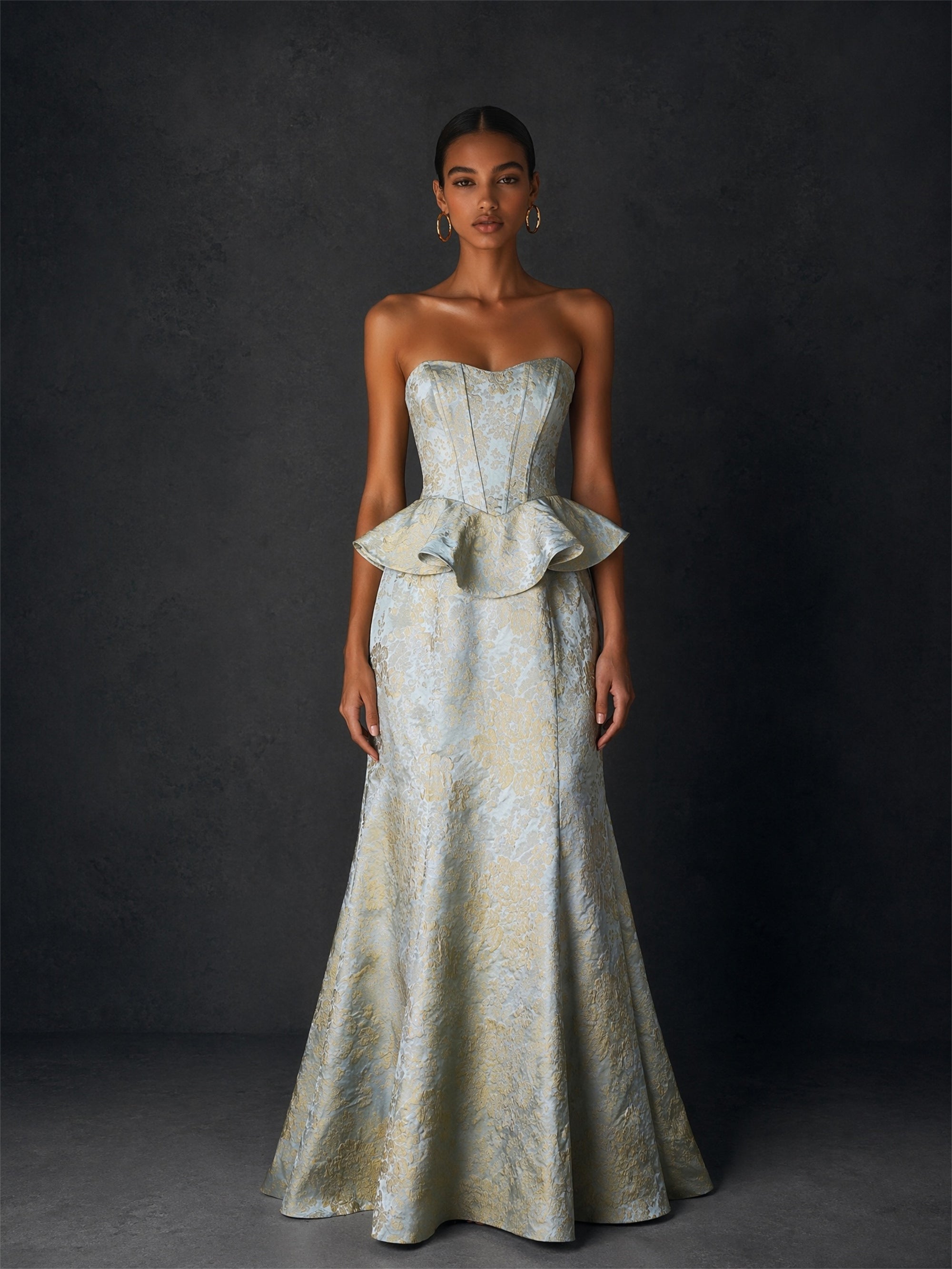 BOLODOO ice blue gold floral jacquard strapless peplum corset mermaid gown - upper body close-up showing sweetheart neckline and corset boning detail with gold hoop earrings