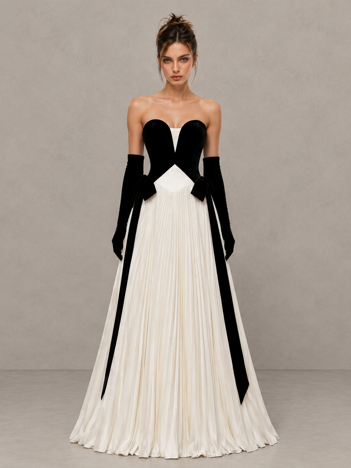 BOLODOO XCD058 black and white strapless evening gown, front view with pleated A-line skirt and waist bows