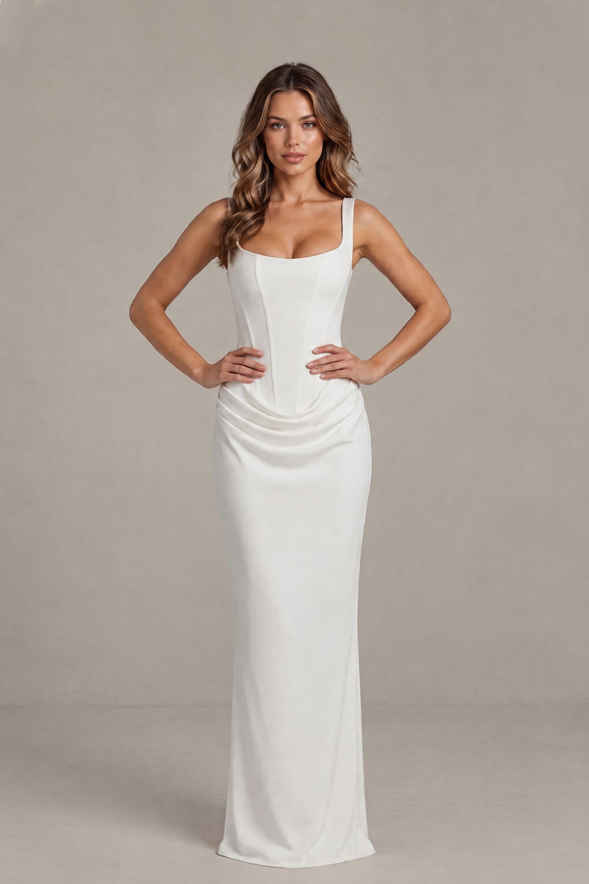 Back view of the white bridal gown showing its open lace-up corset detail