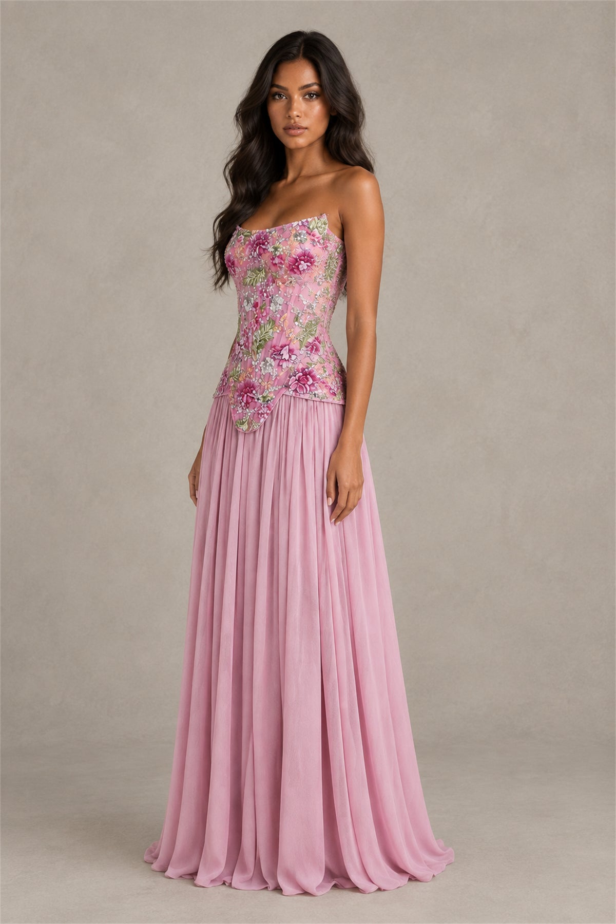 Back view of pink strapless floor length evening gown with pleated skirt