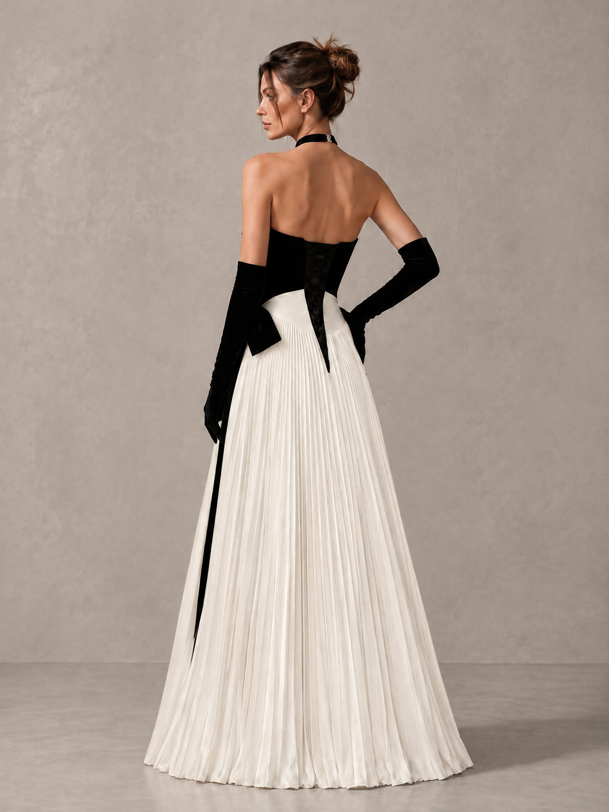 BOLODOO XCD058 black and ivory floor-length gown, back view showing open upper back and pleated skirt