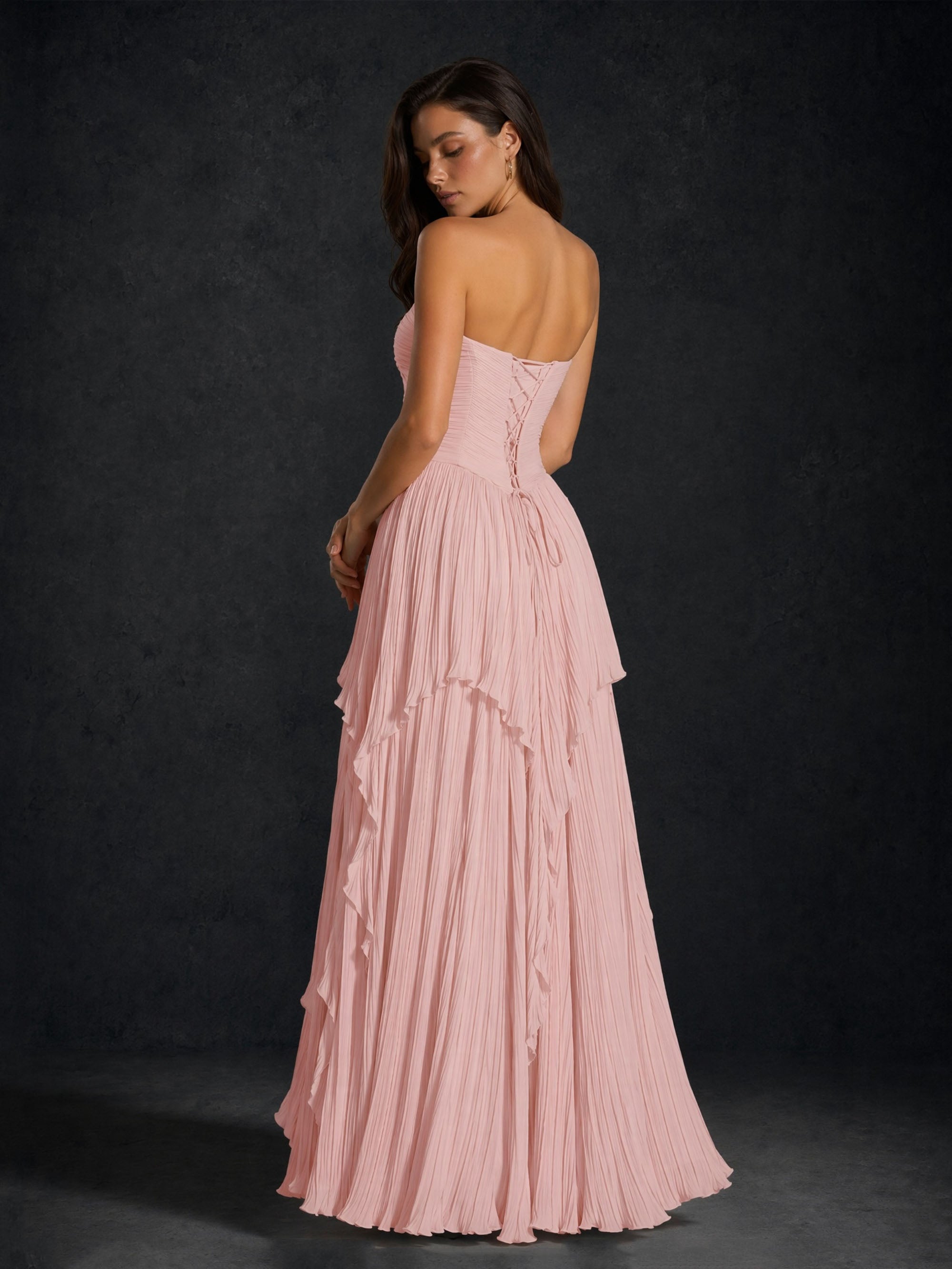 BOLODOO Blush Pink Pleated Chiffon Strapless Lace-Up Corset Back Tiered Ruffle Maxi Dress - Front Seated View Showing Tiered Ruffle Skirt Detail