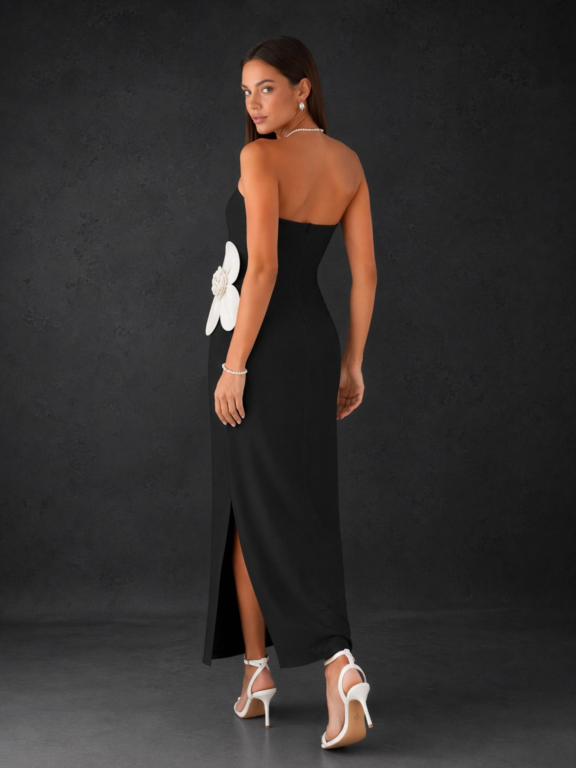BOLODOO Black Strapless Oversized 3D White Flower Appliqué Side Slit Bodycon Midi Dress - Front Full Length Standing with Pearl Bag View