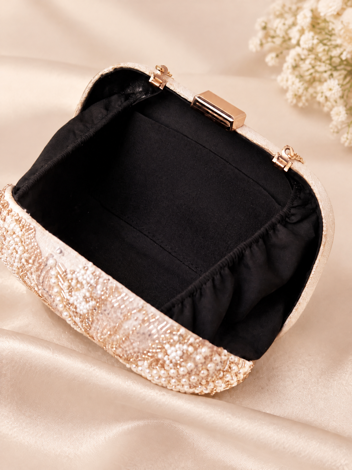 BOLODOO XCD062 clutch open to show black fabric lining, inner slip pocket and clasp frame