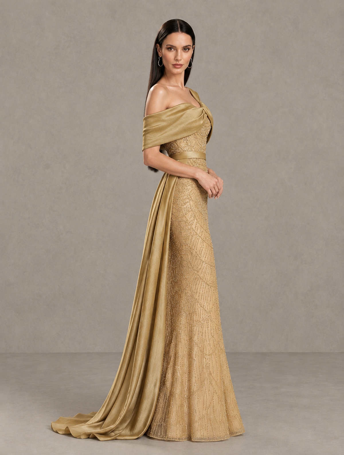 Side view of BOLODOO gold mermaid gown showing off-shoulder draping and sweeping train