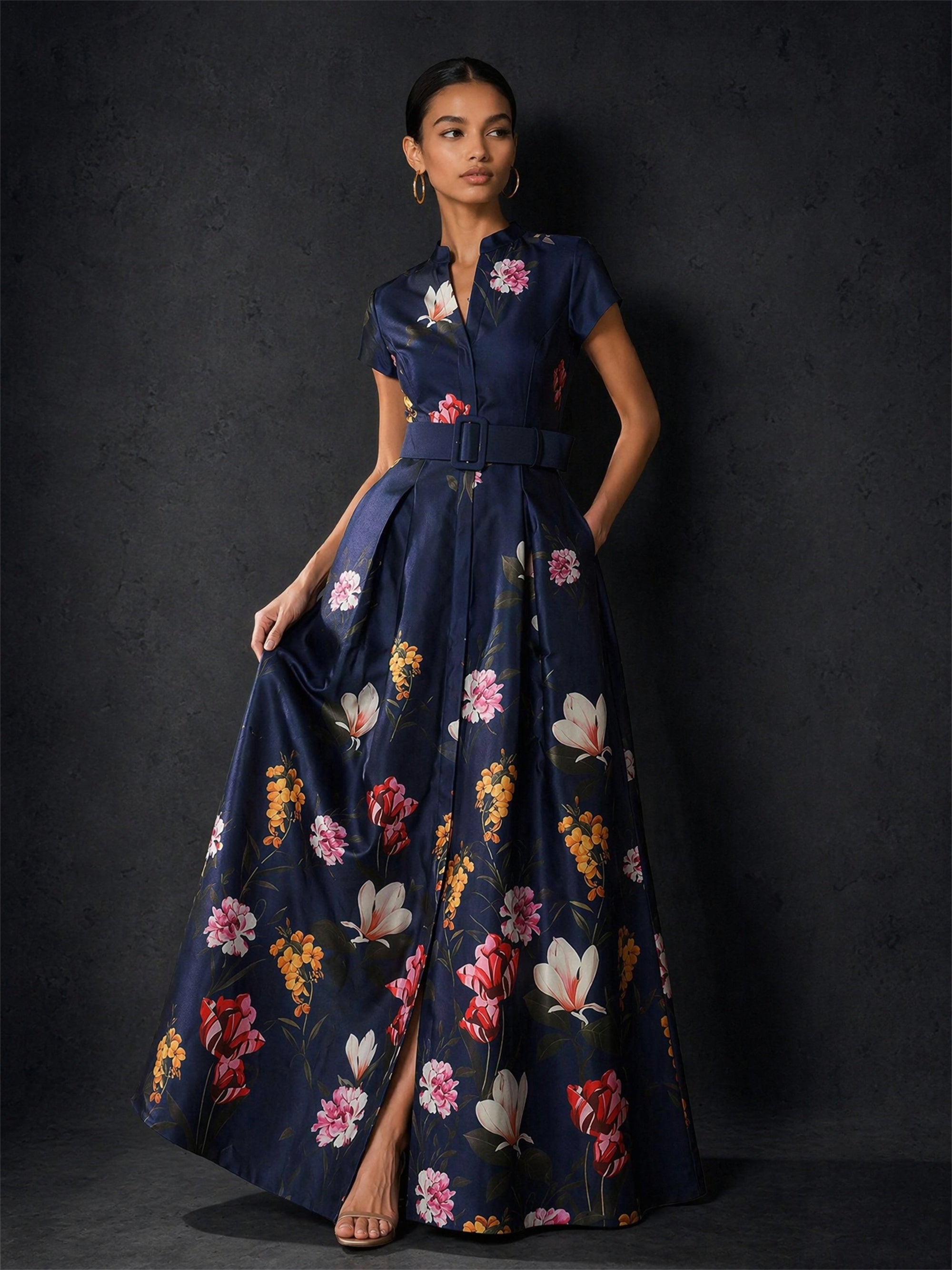 BOLODOO navy blue floral maxi dress - front view with hand on hip showing front slit and full skirt volume
