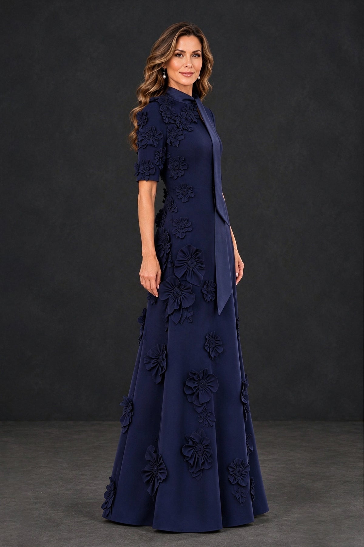 Side view of BOLODOO XX123 navy A-line gown with dimensional flowers and elbow-length sleeves