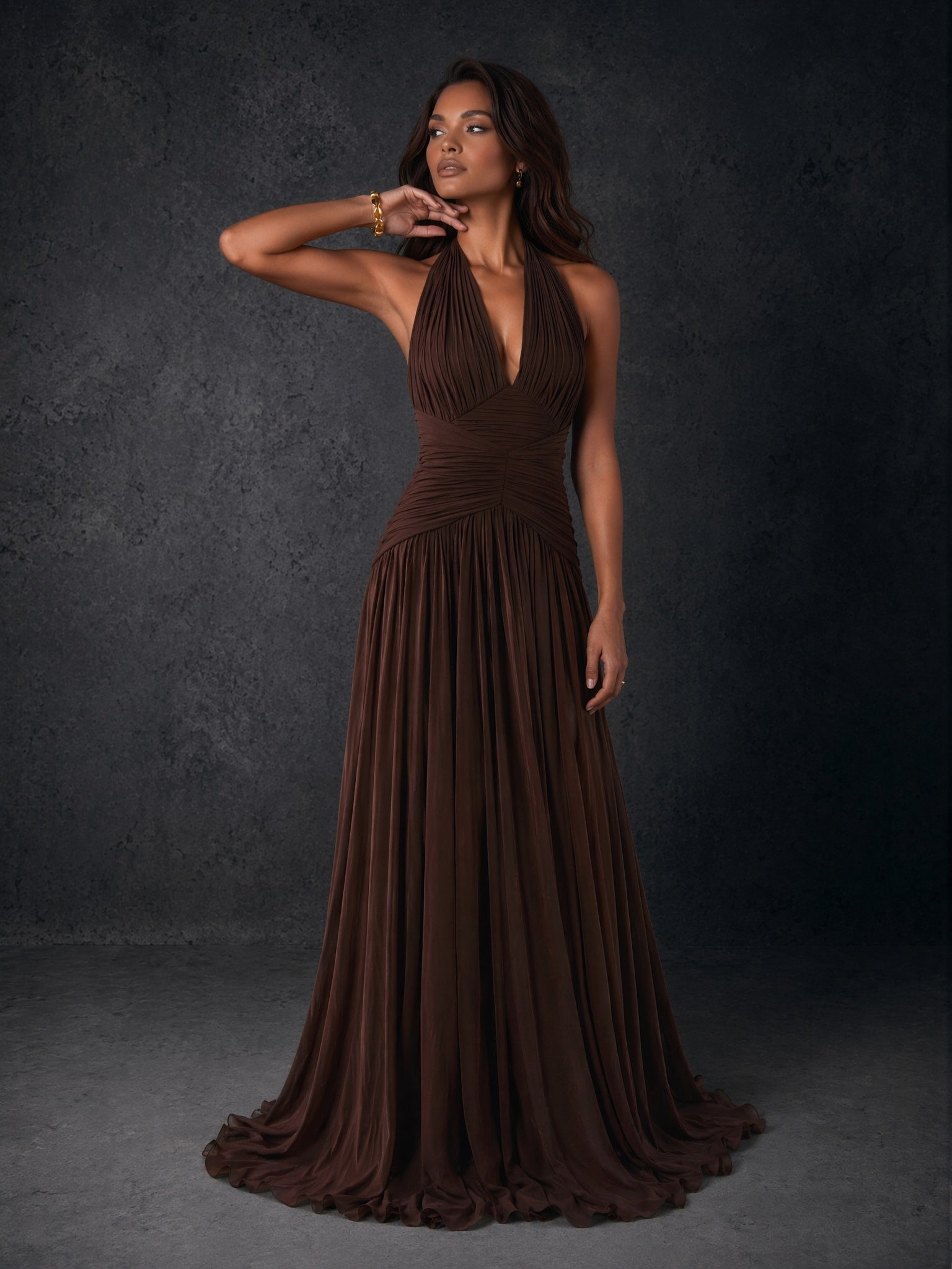 BOLODOO chocolate brown chiffon halter deep V-neck ruched A-line backless maxi dress - front three-quarter view arm raised