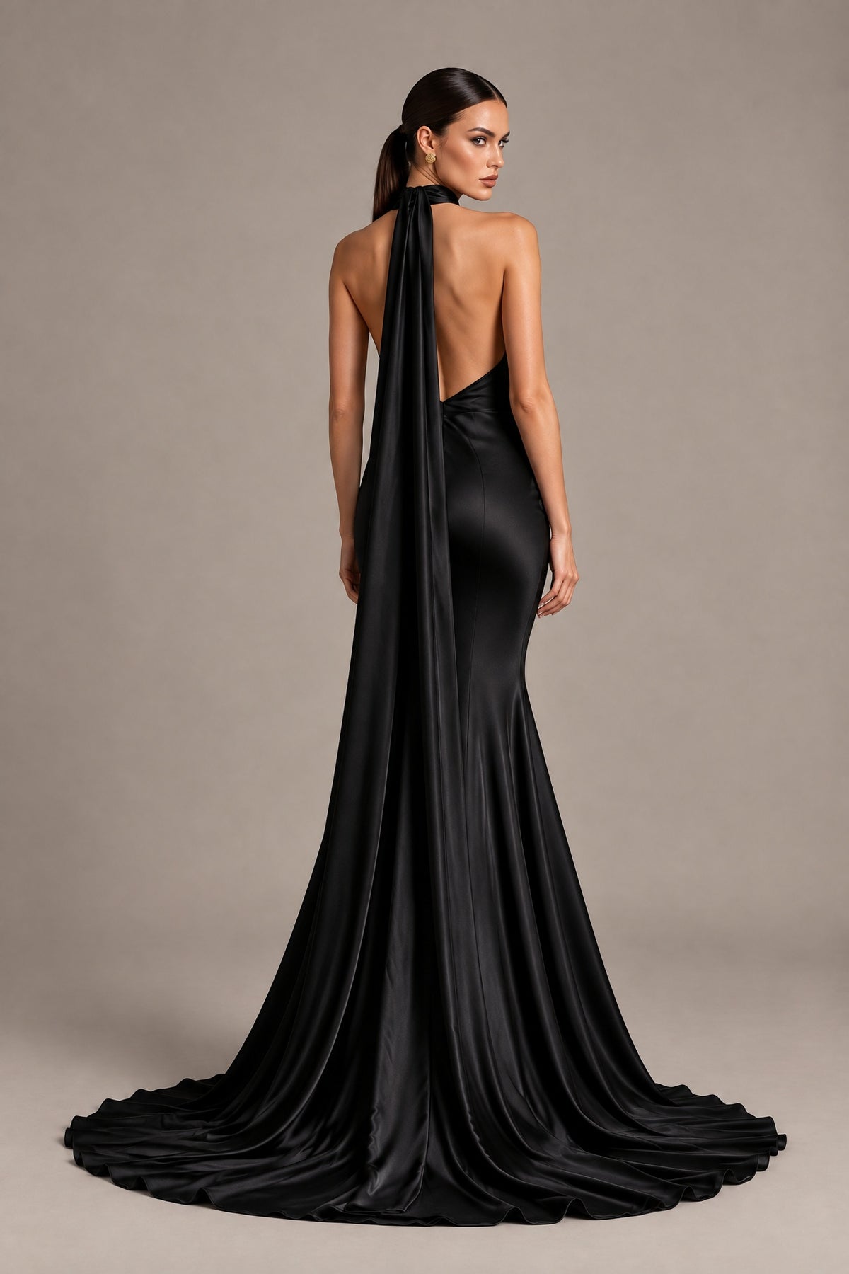 Open back and sweeping train of BOLODOO black one-shoulder mermaid evening gown